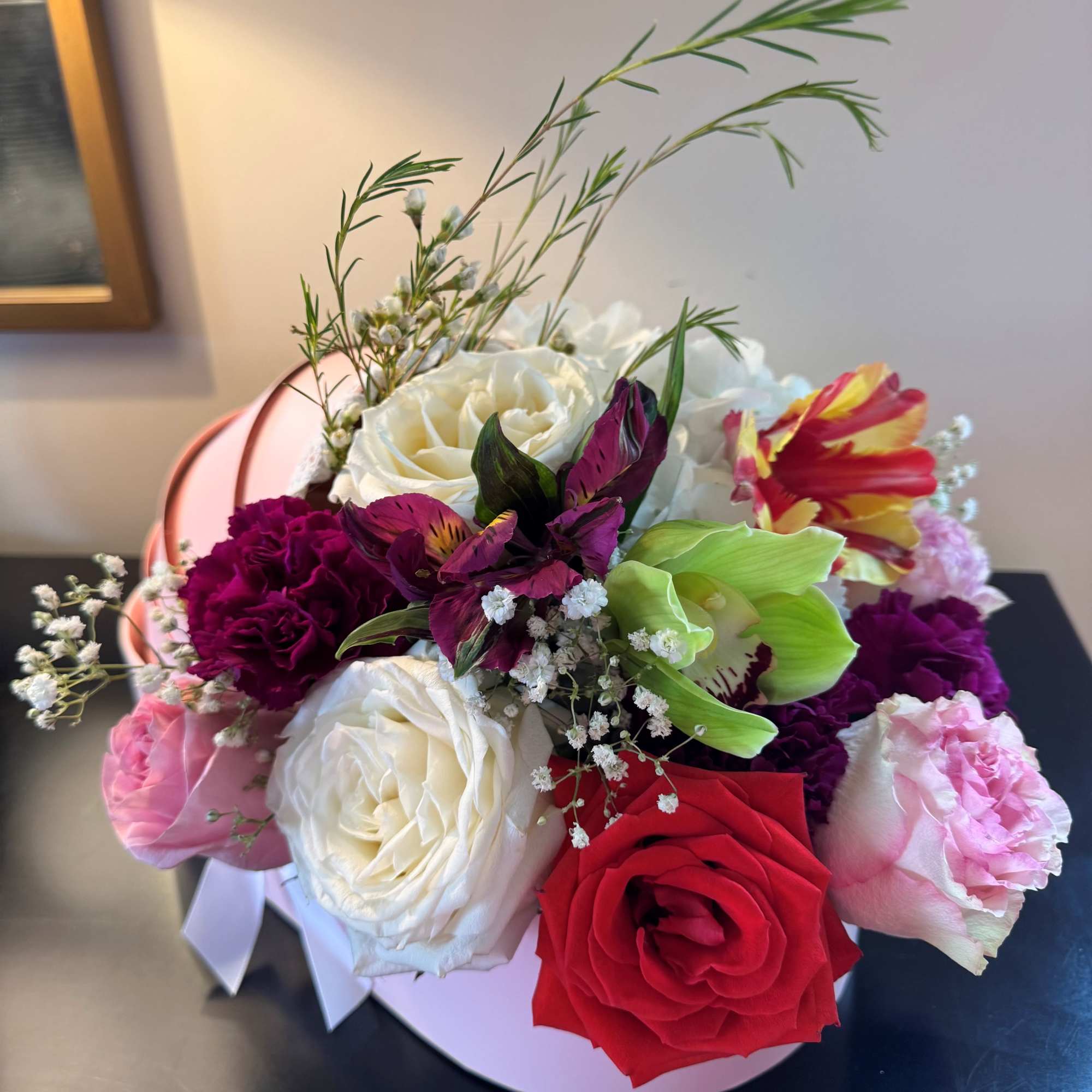 Fresh seasonal flowers in a cradle flower box to celebrate the new