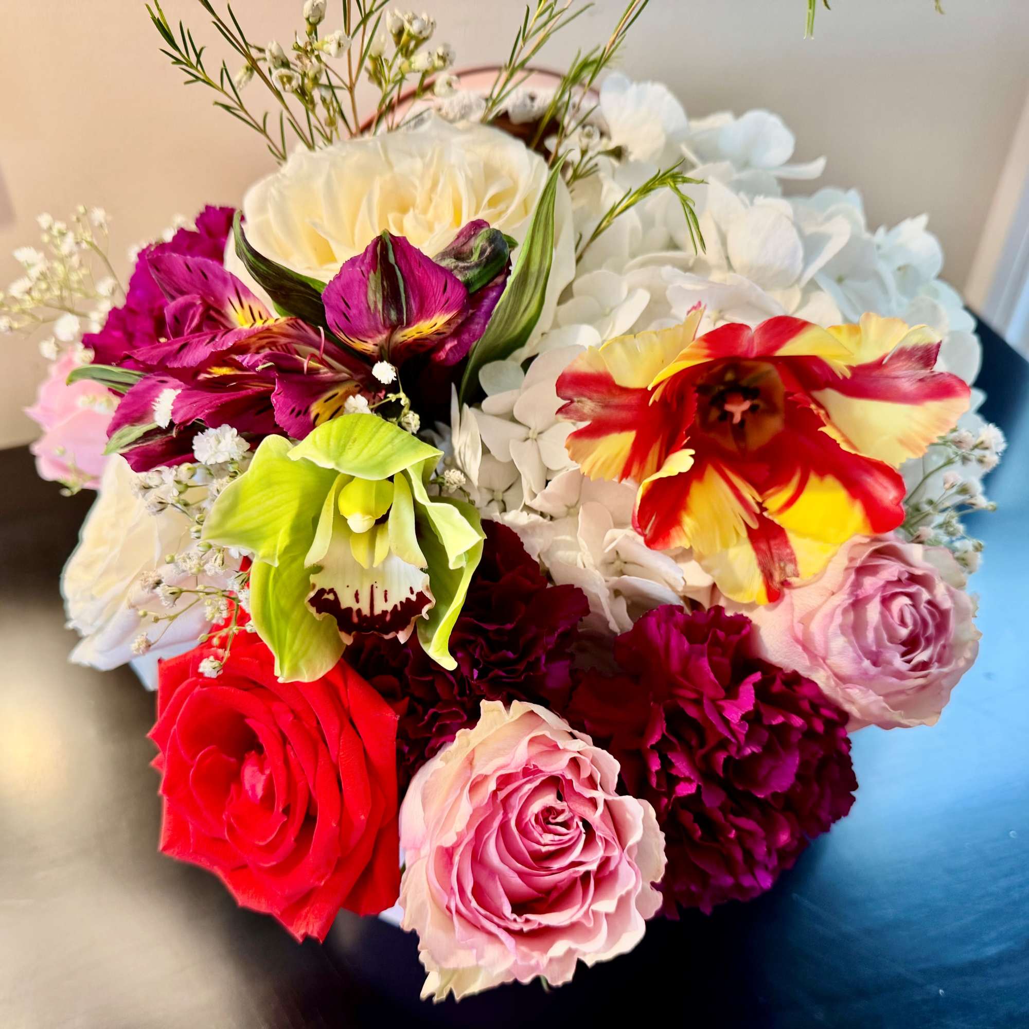 Fresh seasonal flowers in a cradle flower box to celebrate the new
