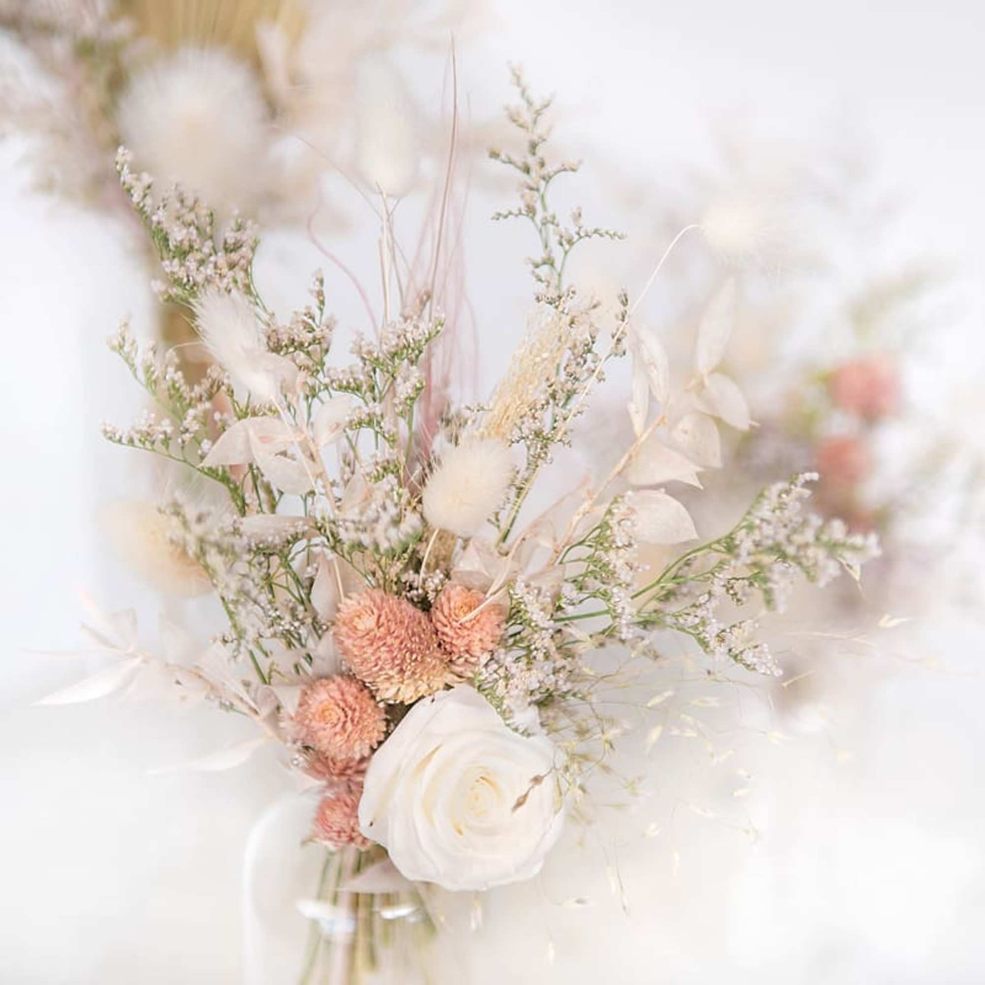 Mini arrangements of assorted white, creme, &amp; pastel dried florals in a