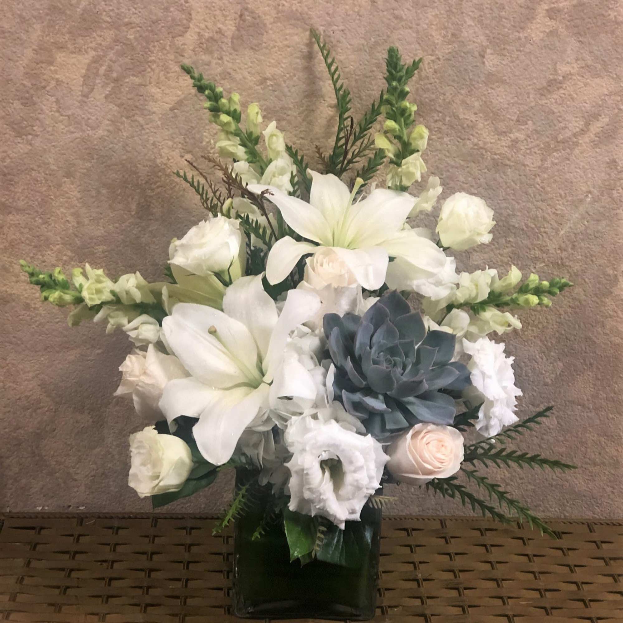 Recipe: All white arrangement and succulent in a square vase wrapped with