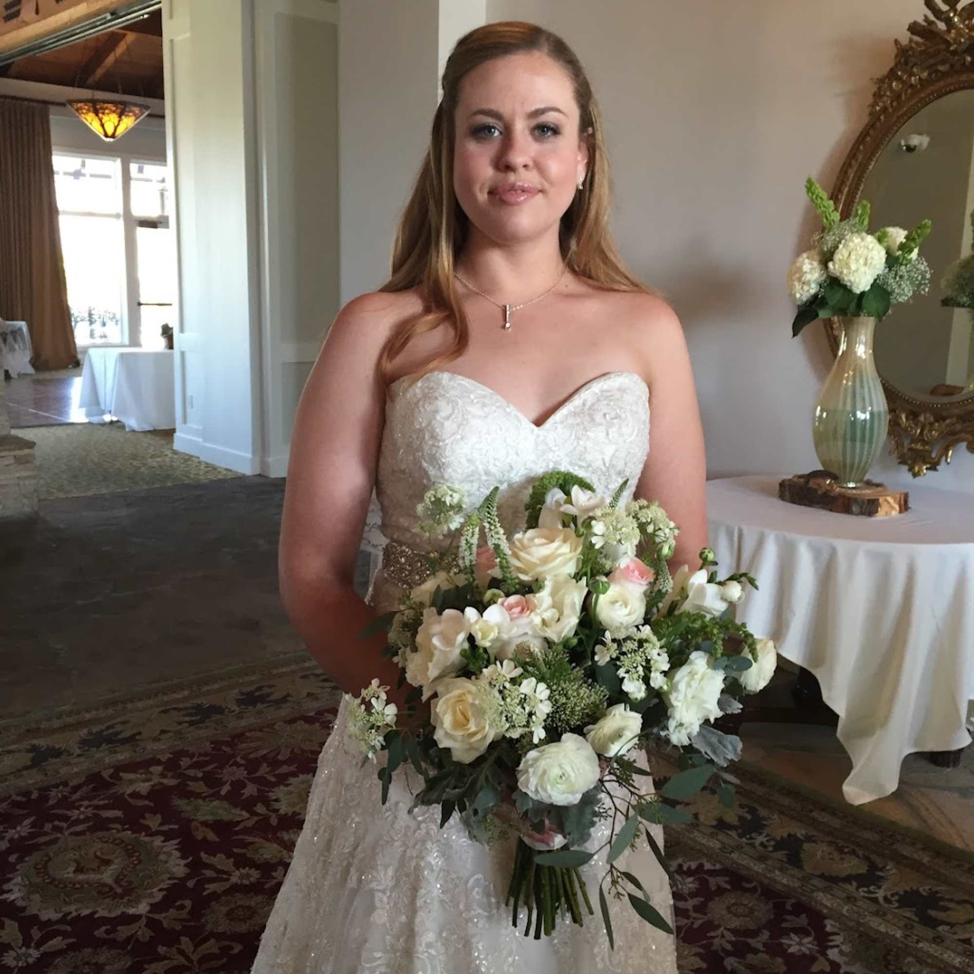 This beautiful, blushing wedding bouquet includes Roses, Lisianthus, Freesia, Ranunculus, and more