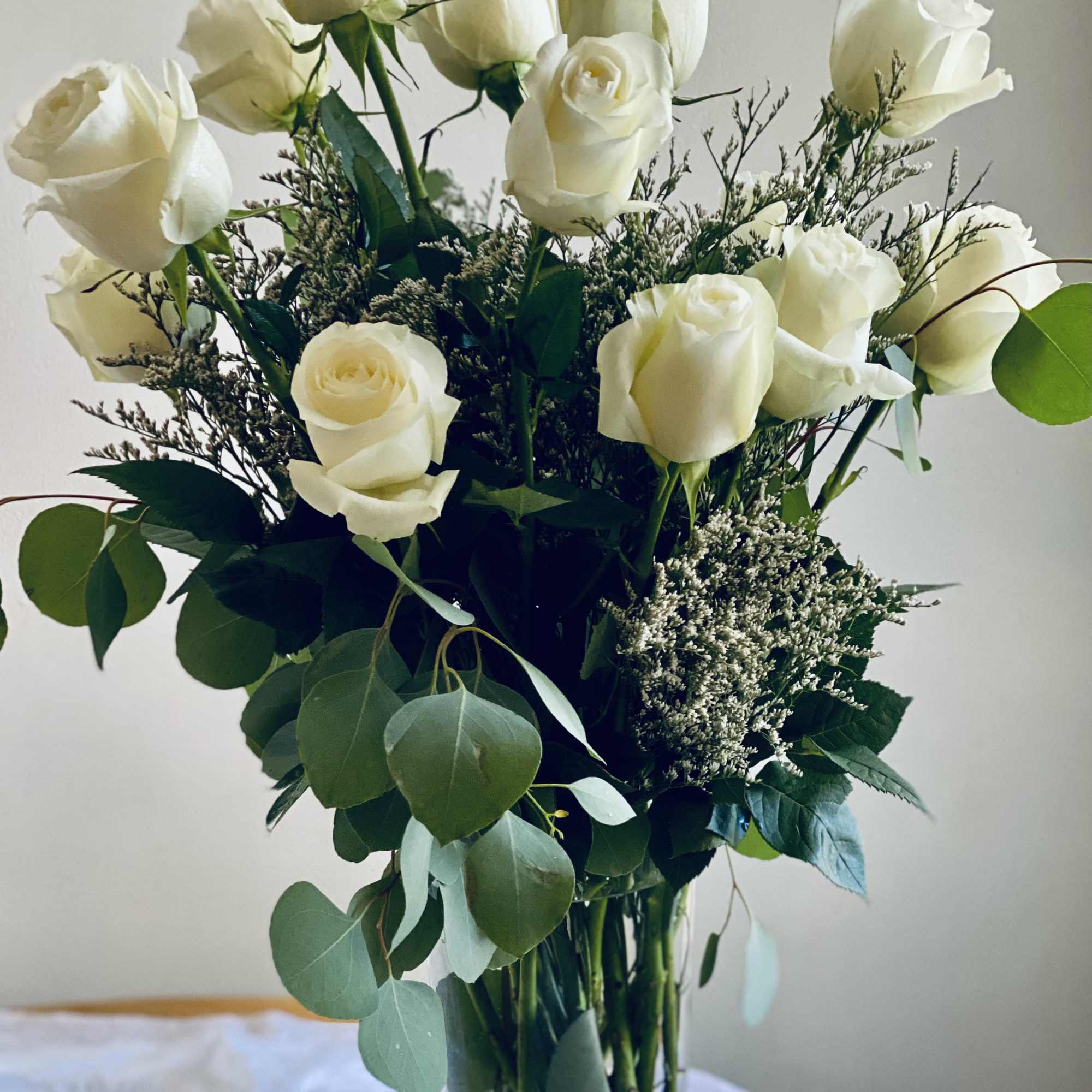 A charming arrangement of a dozen or two dozen high-quality, long-stemmed, fresh