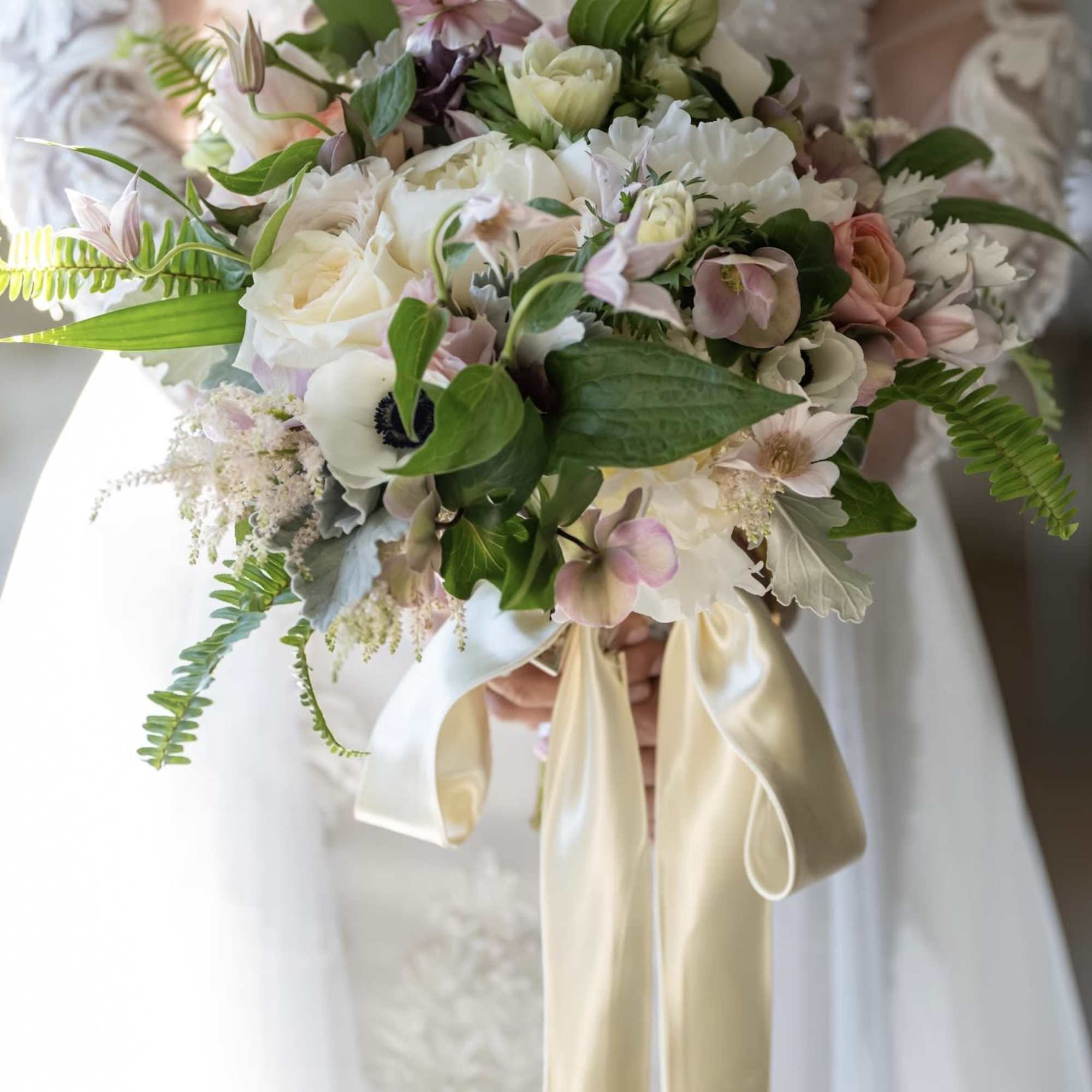 A soft garden&ndash;inspired bridal bouquet designed for the modern romantic. Filled with