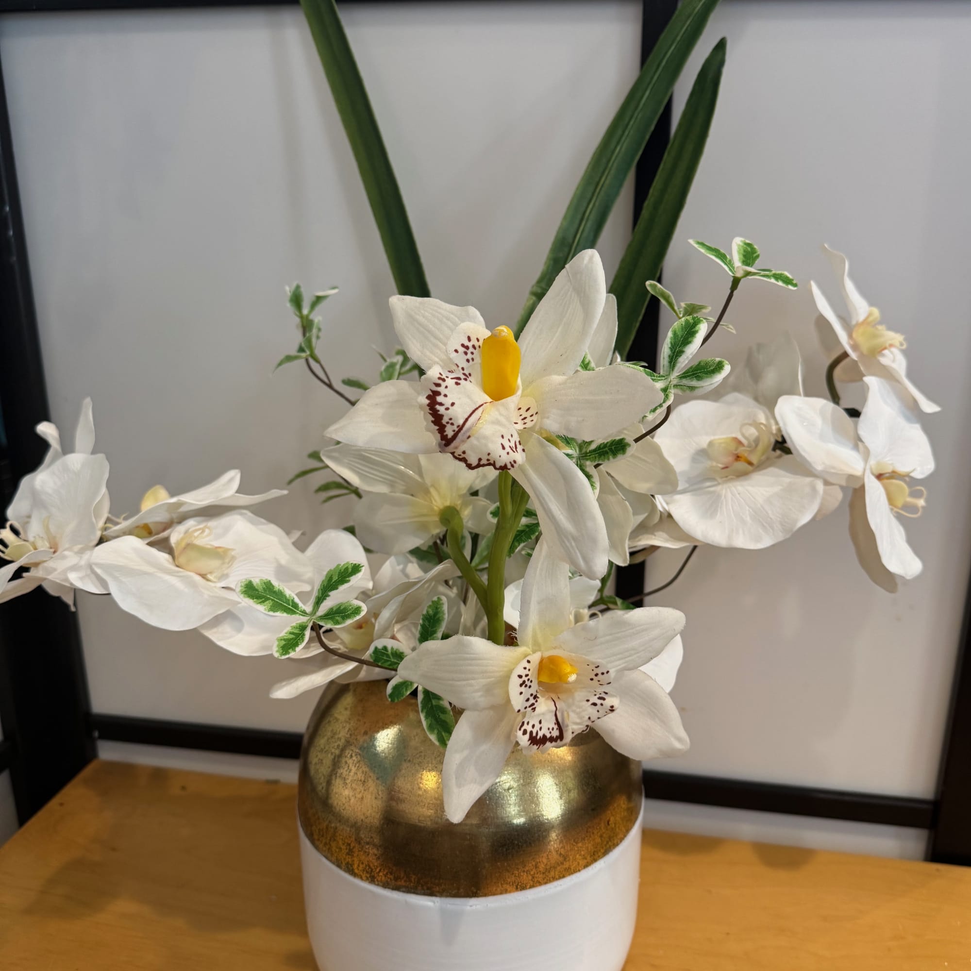 You may order this arrangement with silk orchids as pictured, a plant