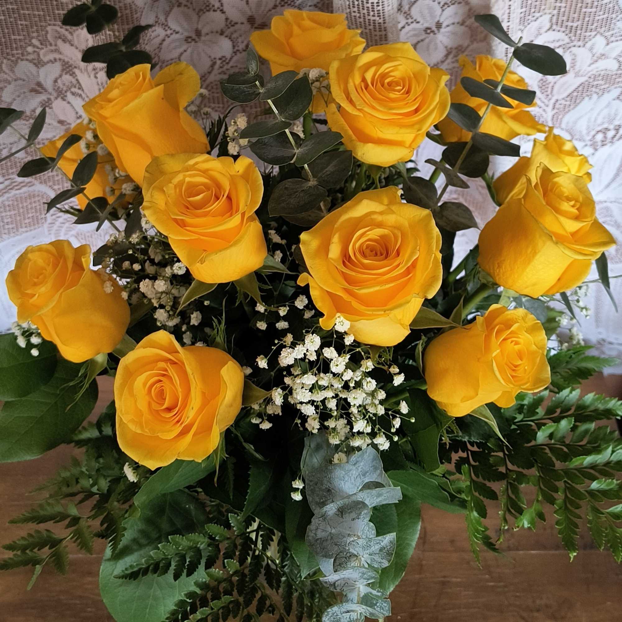 Sunshine yellow roses are sure to brighten any ones day. These sunny