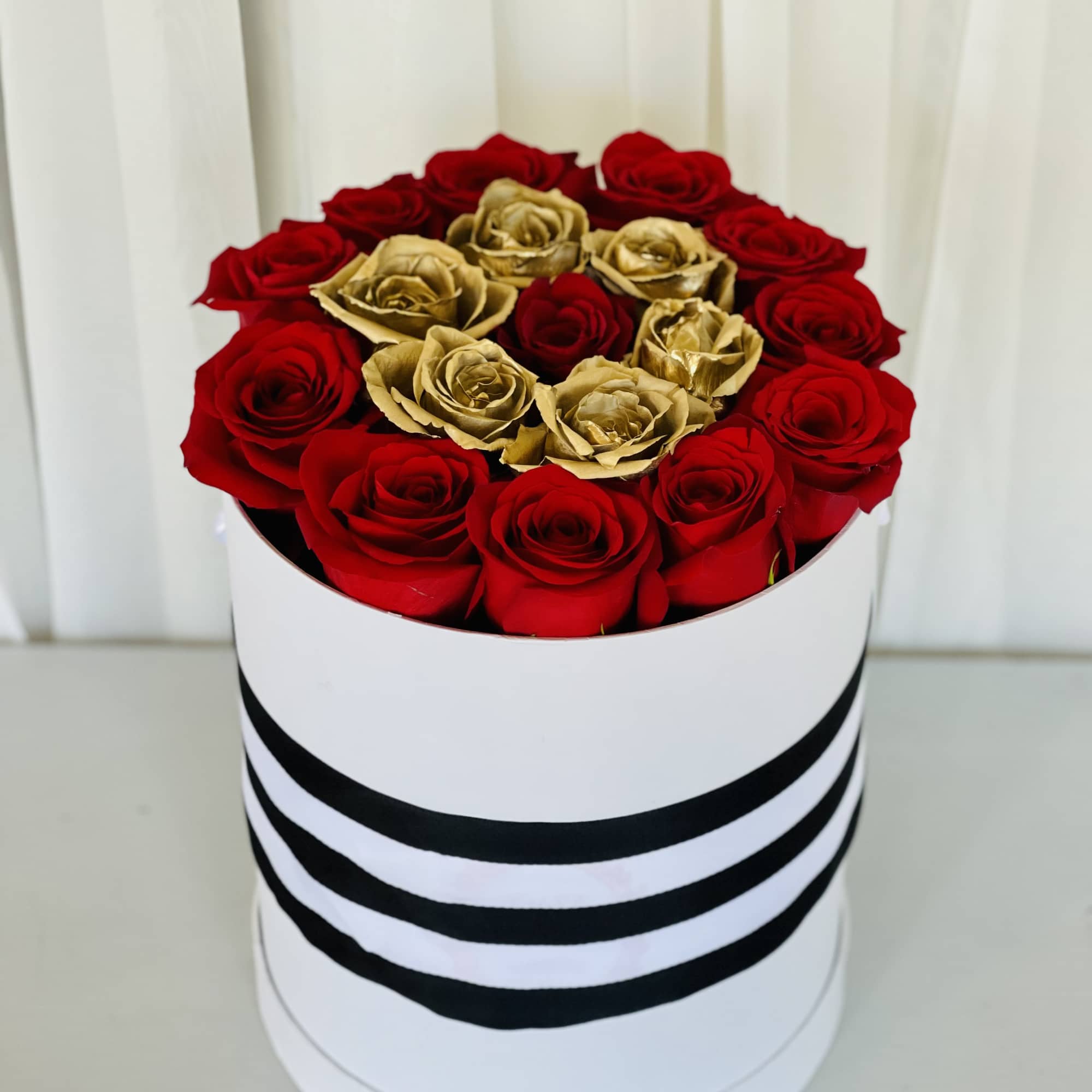 Our box features red and gold roses! There&rsquo;s no better gift for