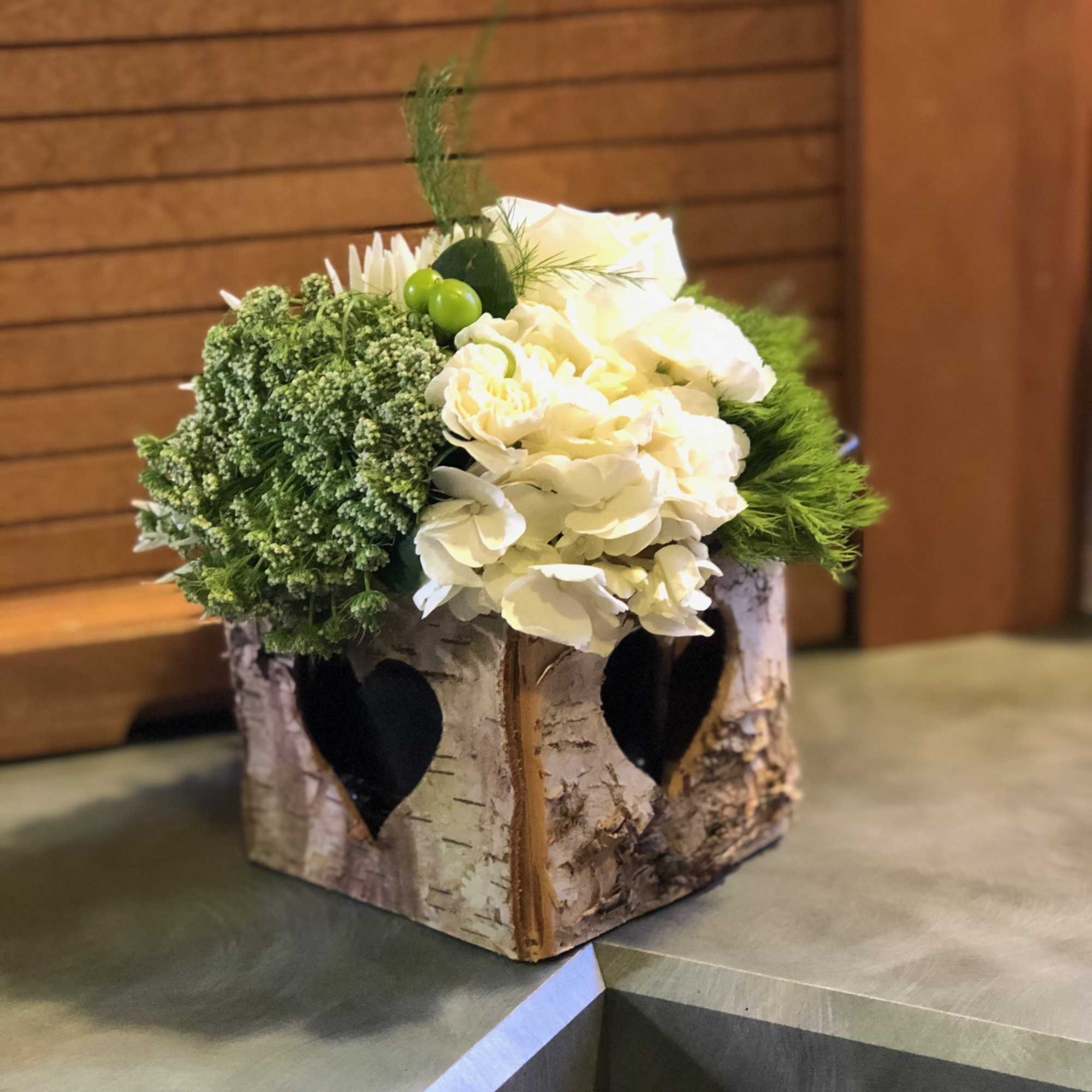 A cut out heart is displayed on every side of our Birch