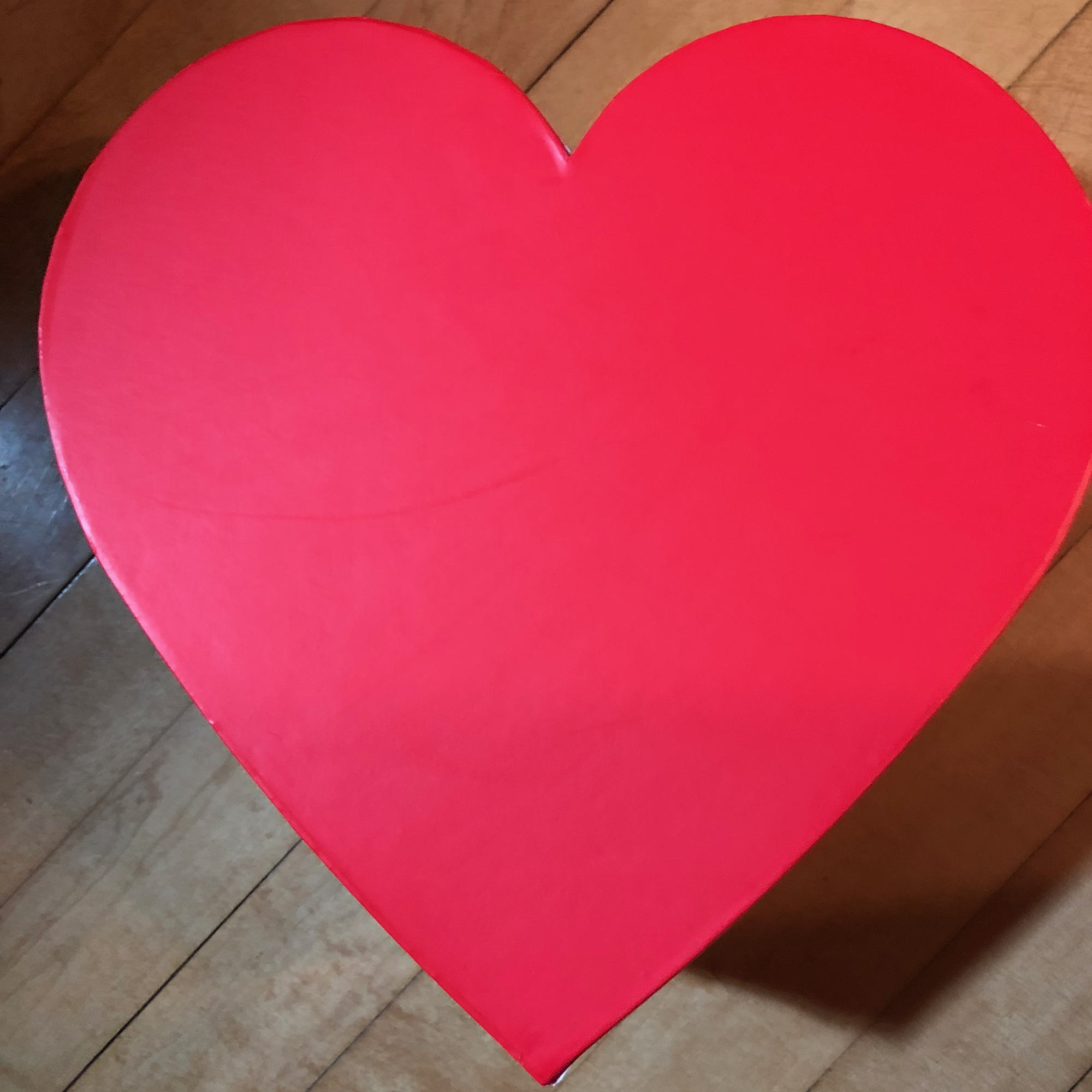 A beautiful heart box filled with roses, accented with a scented soy