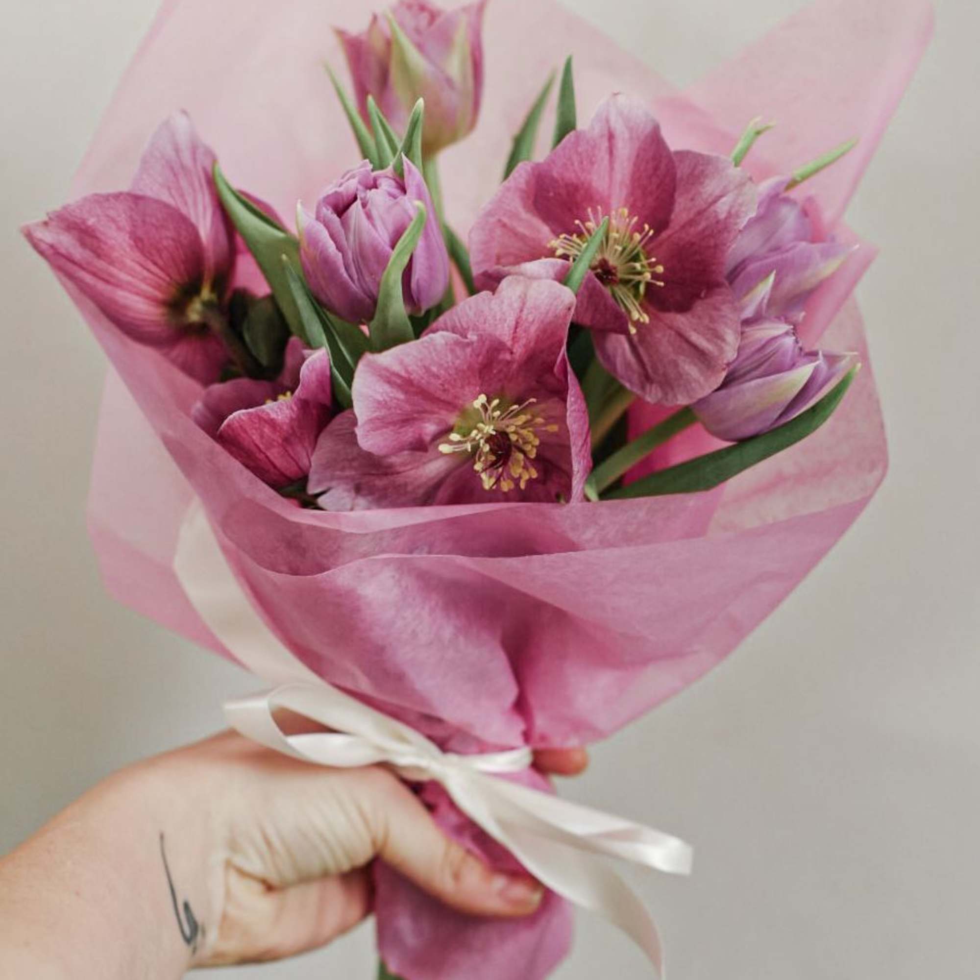 Small designer's choice wrapped bouquet. Colors and flowers will vary depending on