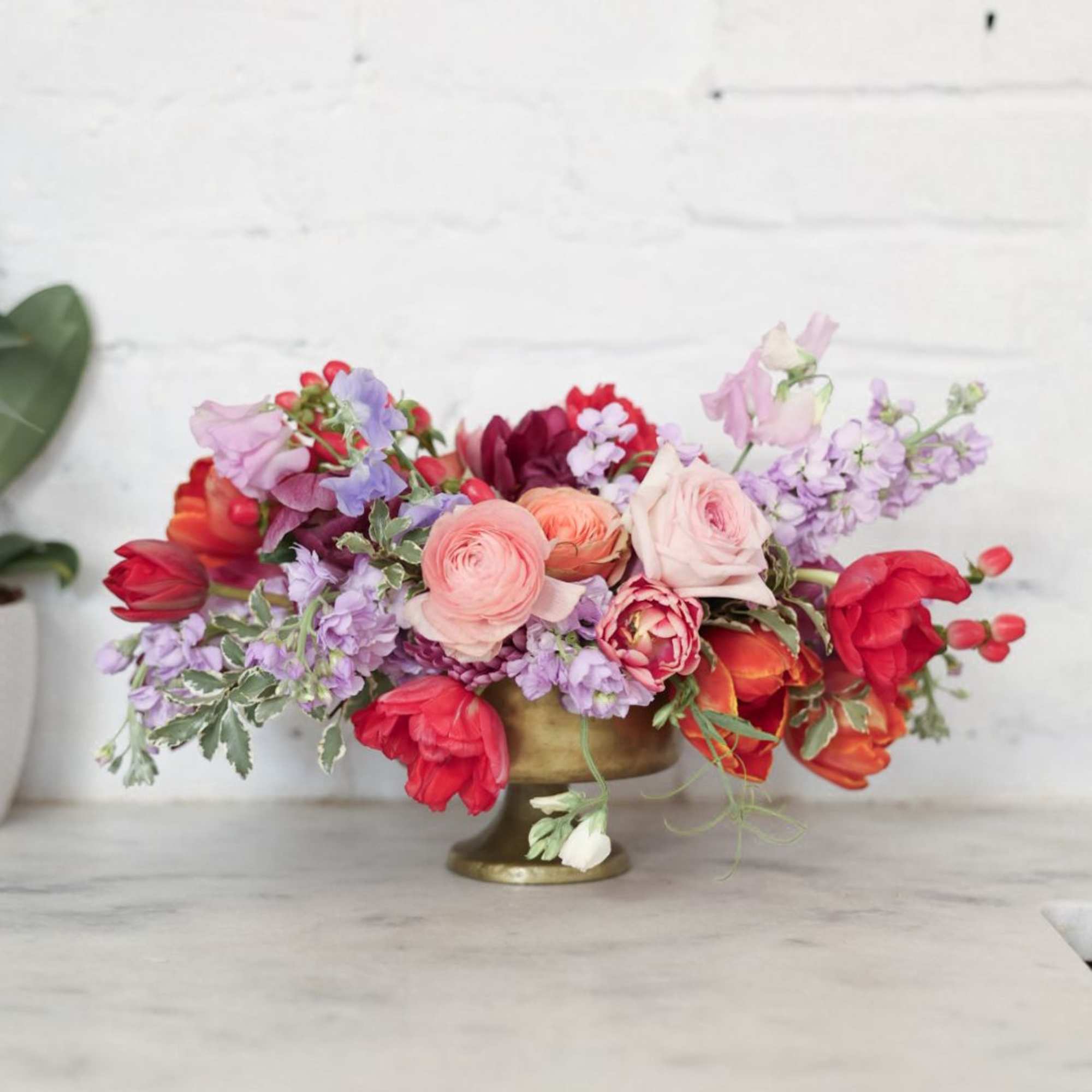 A stunning arrangement of tulips, stock, garden roses, ranunculus, sweet peas +