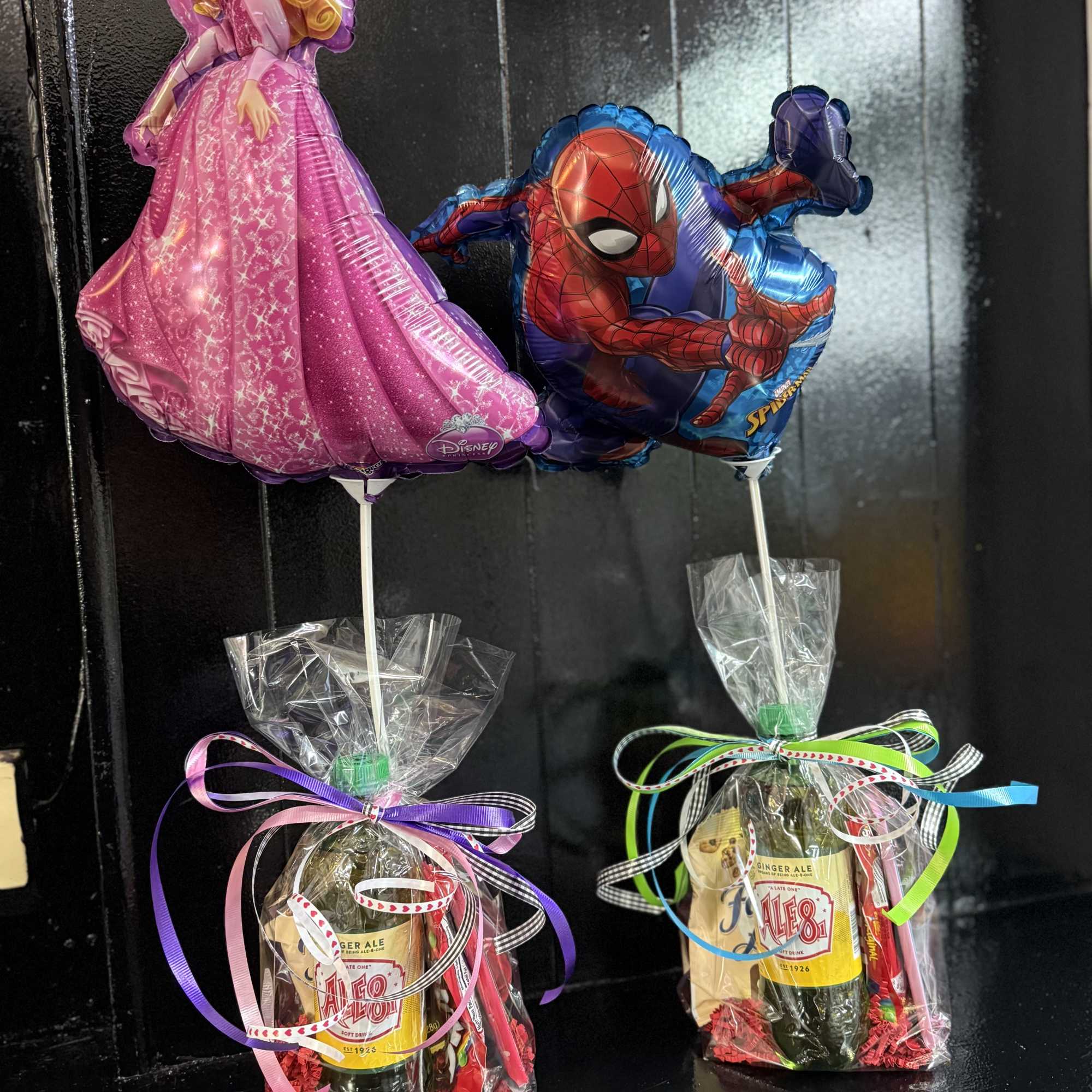 The Valentine candy arrangement include an 30oz. Plastic Ale8, heart shaped box