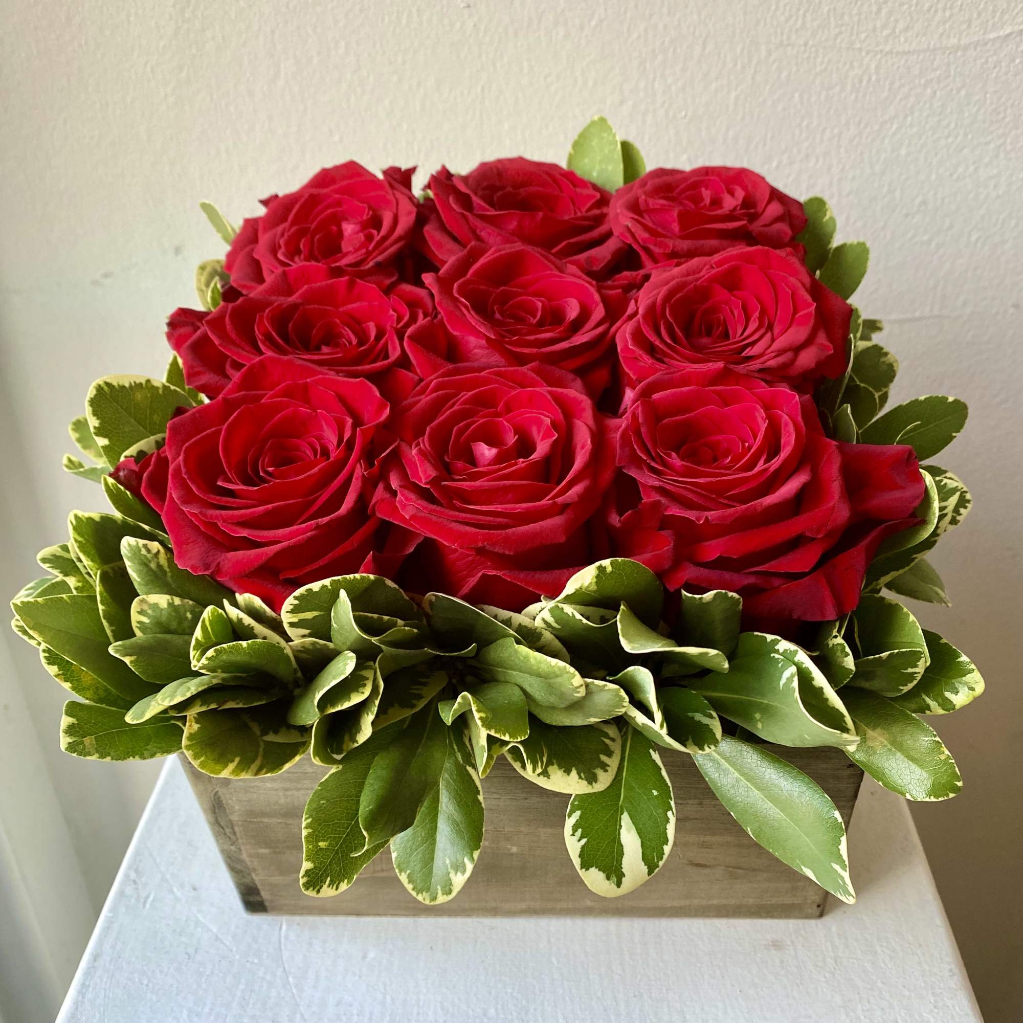 Trendy Box of Designer Big Head Roses available with greens in a