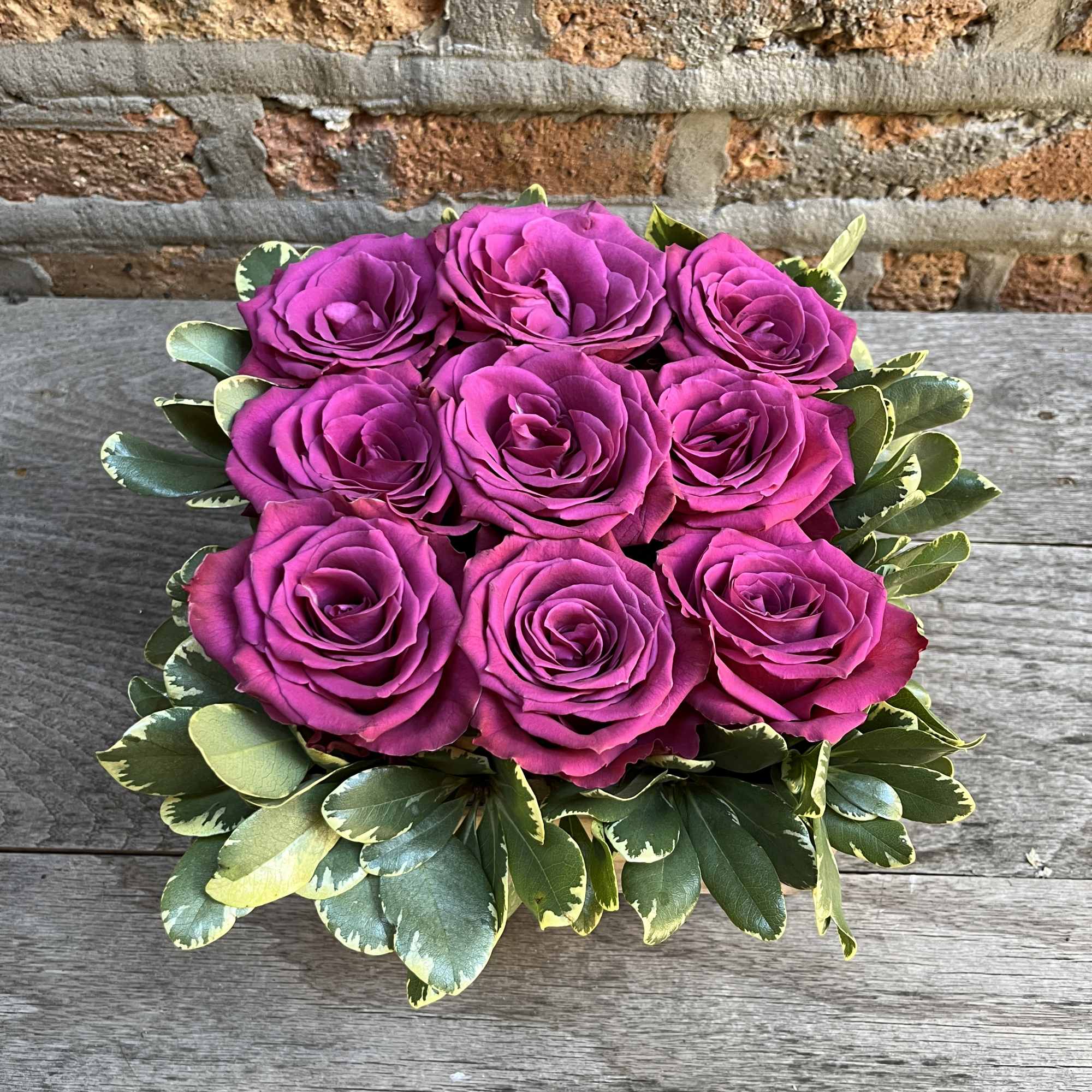 Trendy Box of Designer Big Head Roses available with greens in a