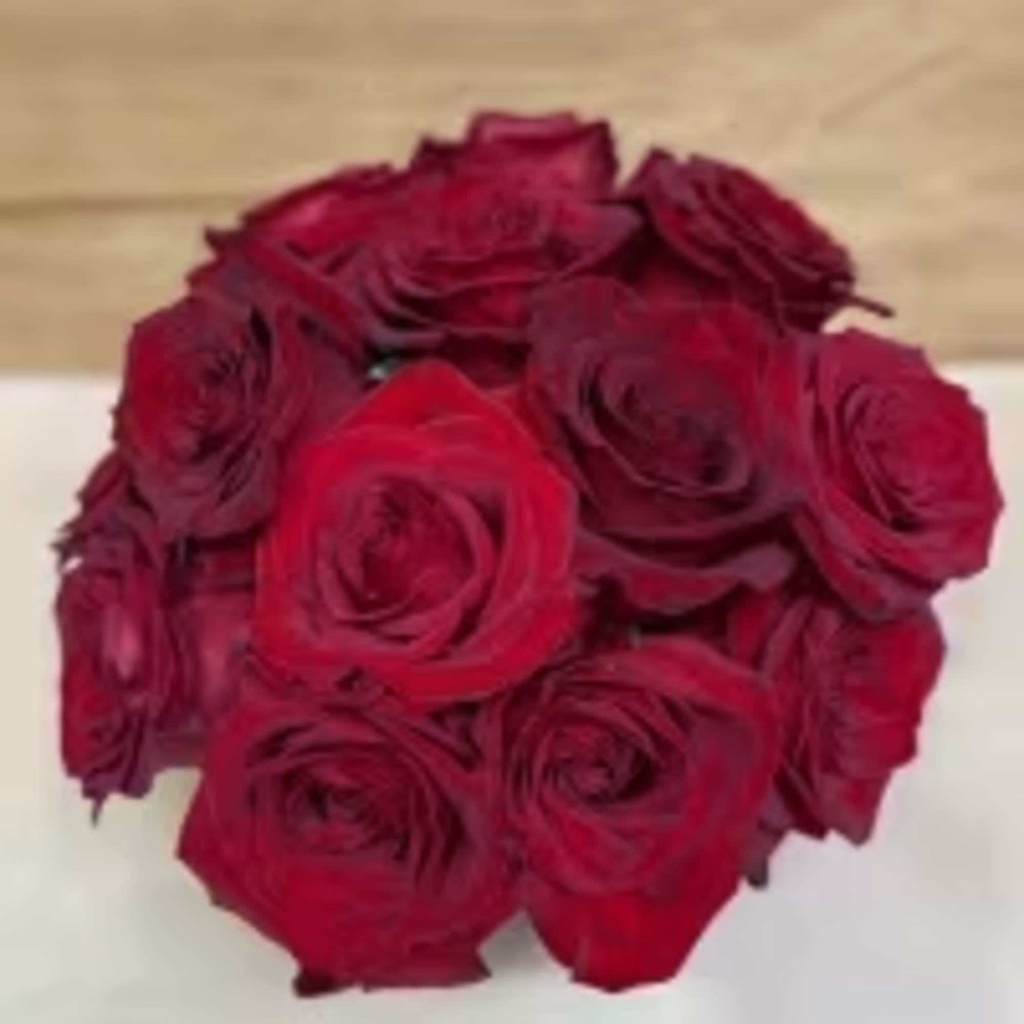 15 red roses exquisitely arranged in a 6" bubble bowl..
Height: Approximately 10"