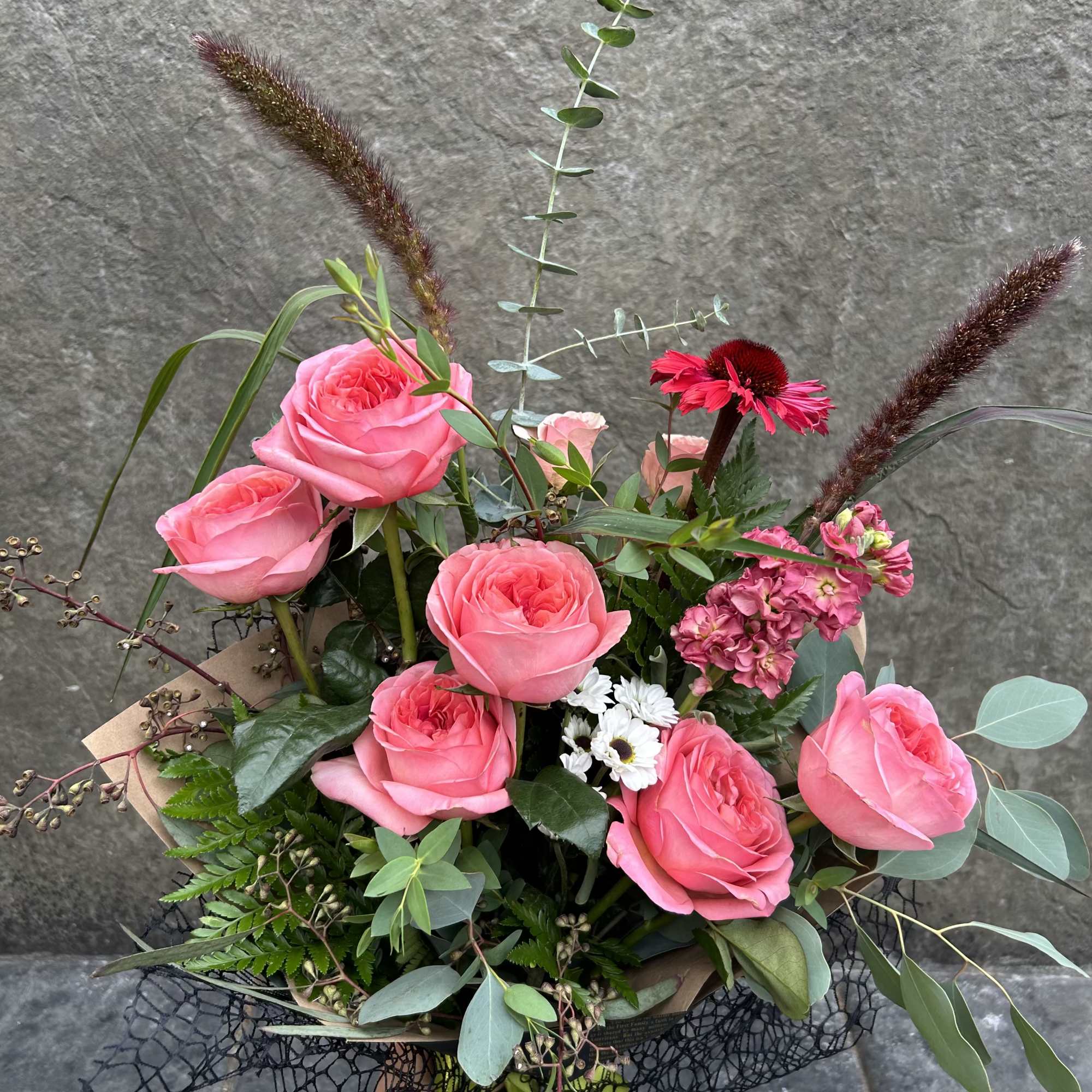 Half Dozen Roses with seasonal blooms, mixed greens, and eucalyptus. Wrapped, 