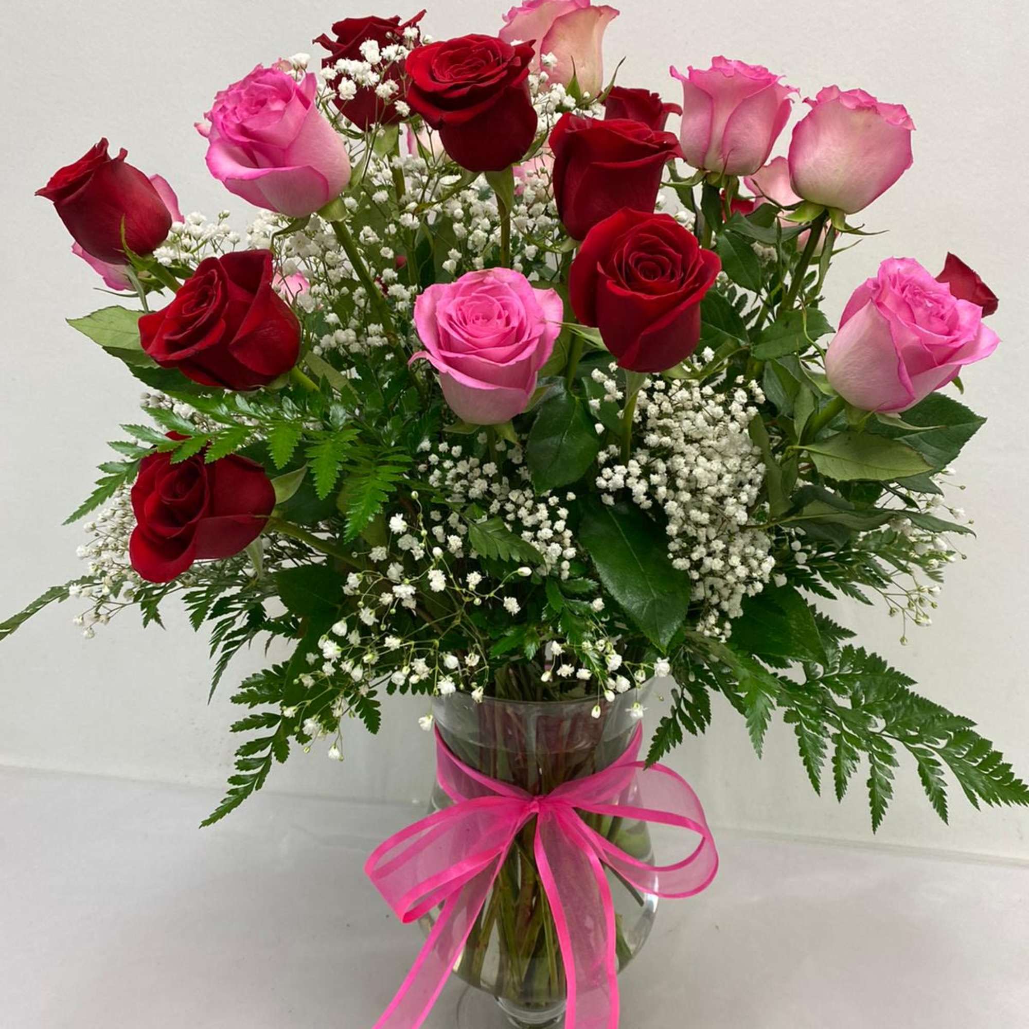Premium two dozen red + pink roses along with baby's breath and