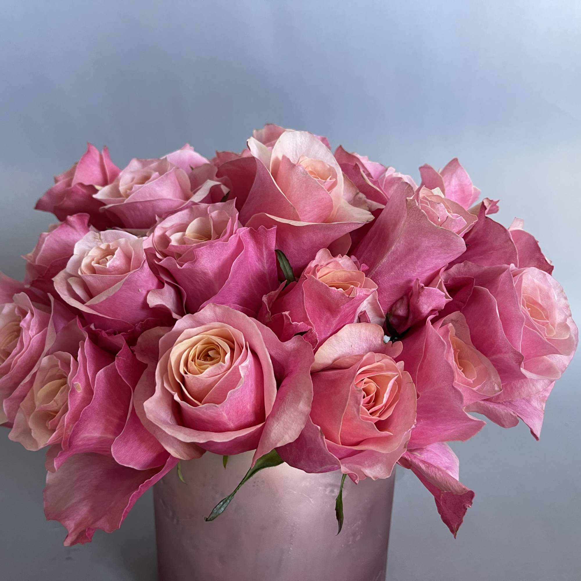 30 stems of flamingo pink roses and a rose gold or silver