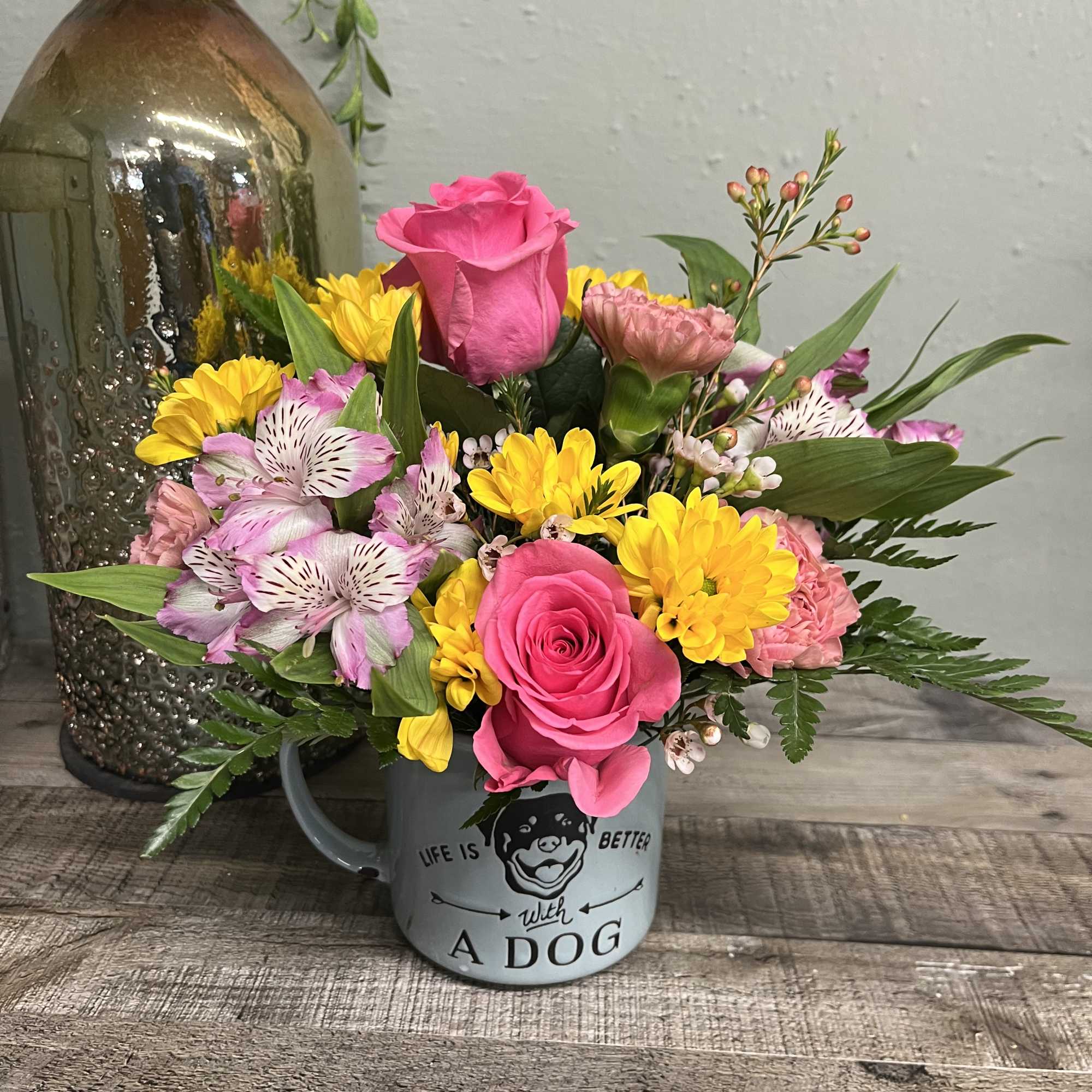 Blue Sky Clayworks Dog Mug with an assortment of fresh blooms. We