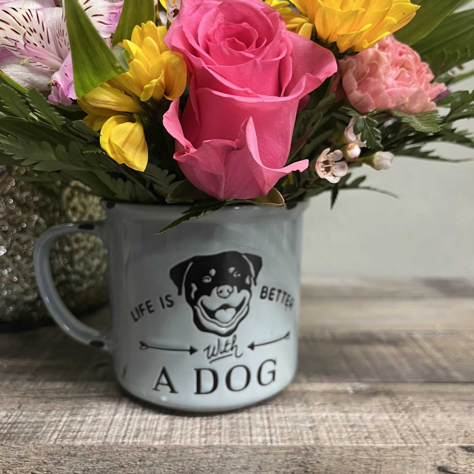 Blue Sky Clayworks Dog Mug with an assortment of fresh blooms. We