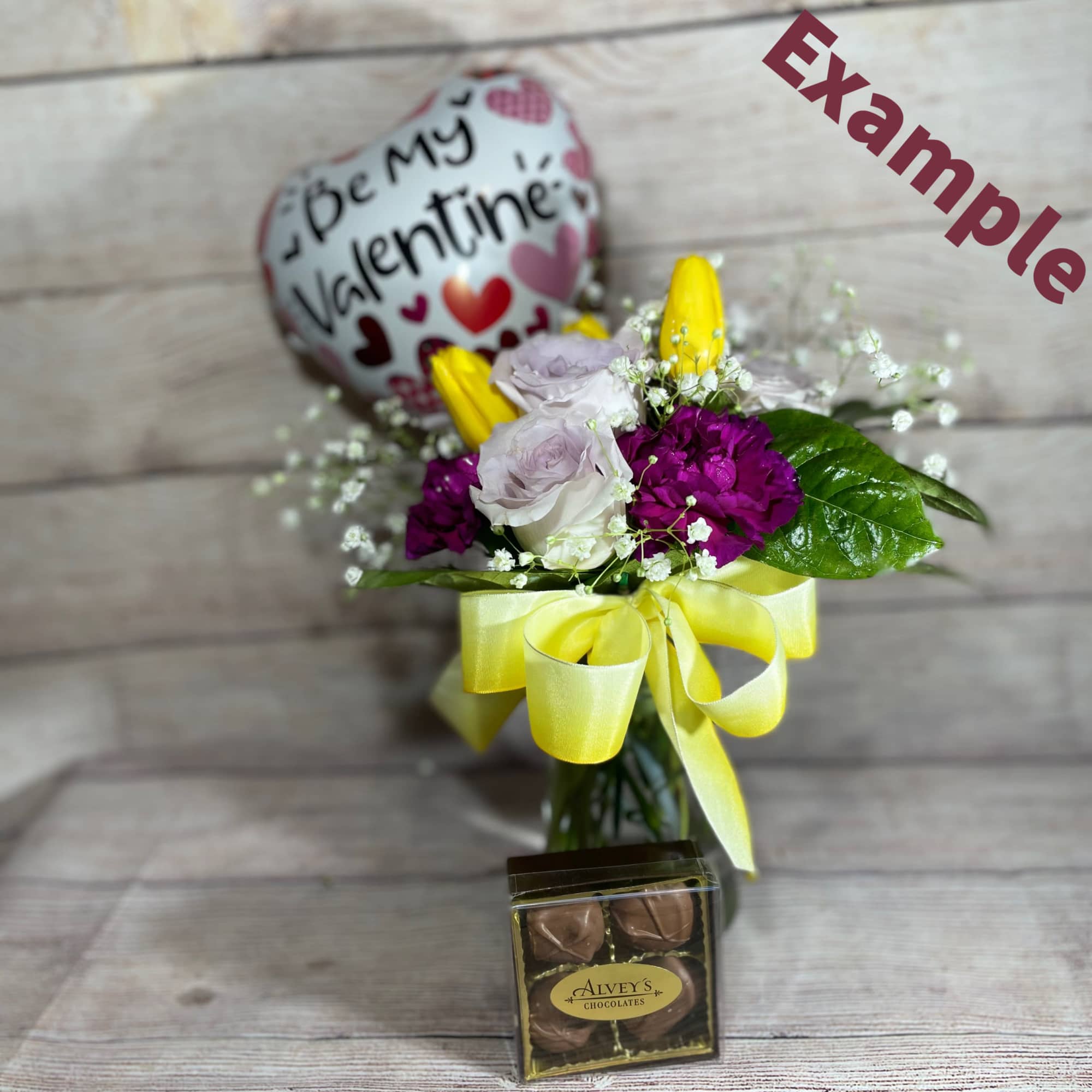 Small bouquet of Valentine Flowers, 4 piece of chocolates and a stick