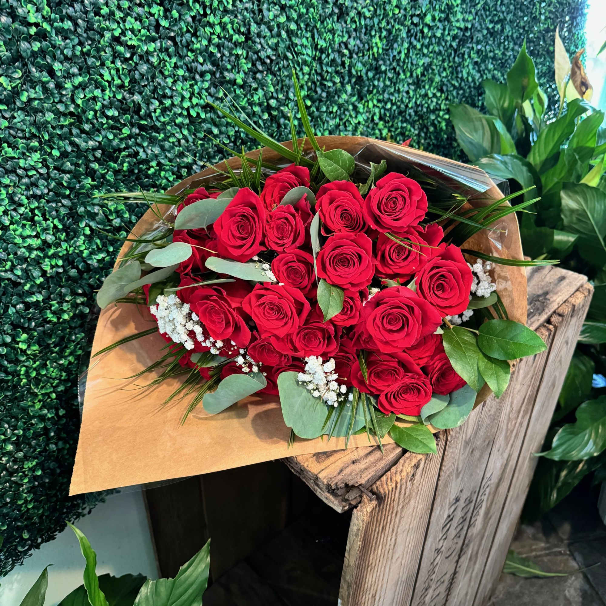 Beautiful 2 Dozen Ecuadorian red roses wrapped in brown paper.  