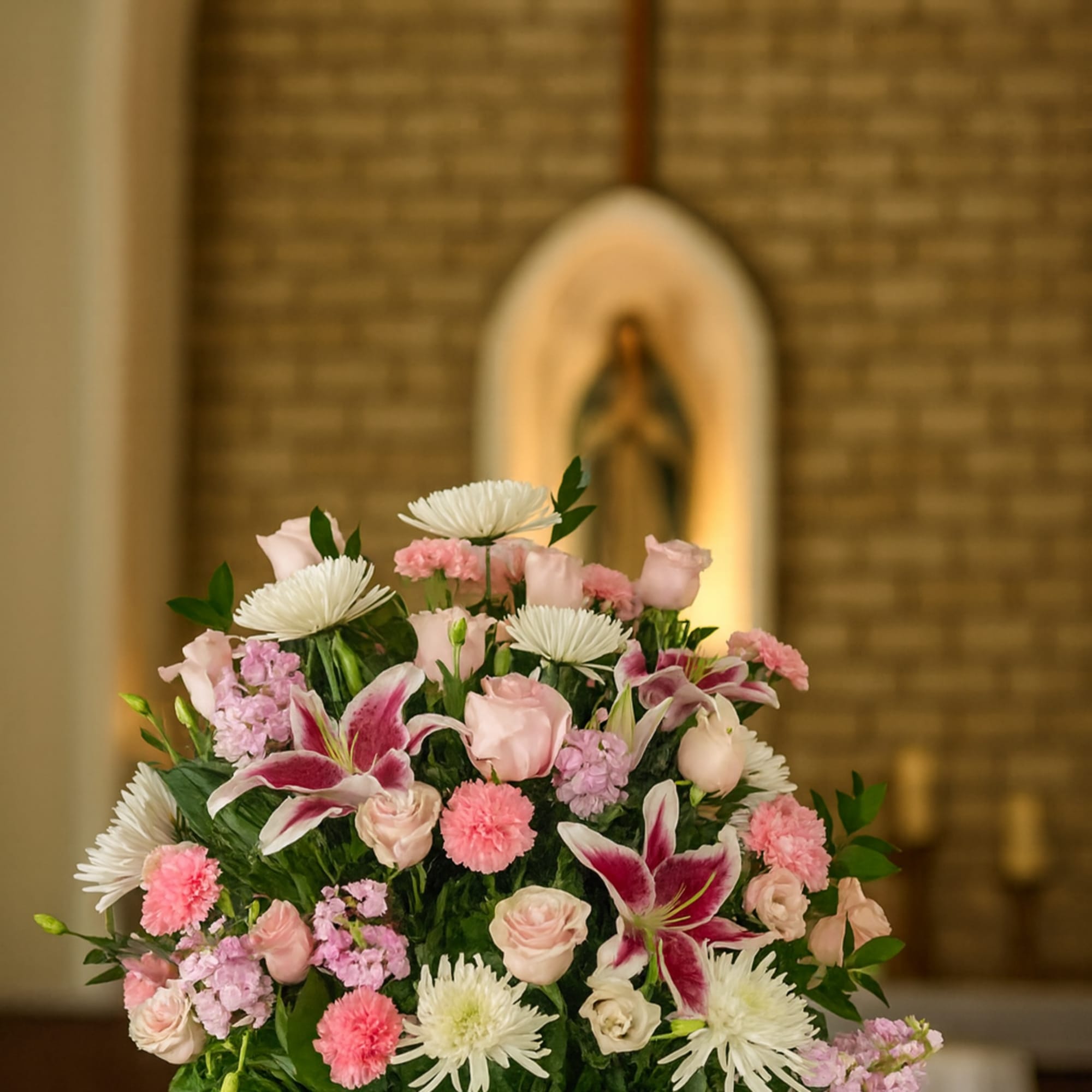 This pink and white funeral in square white vase 
 includes Banner