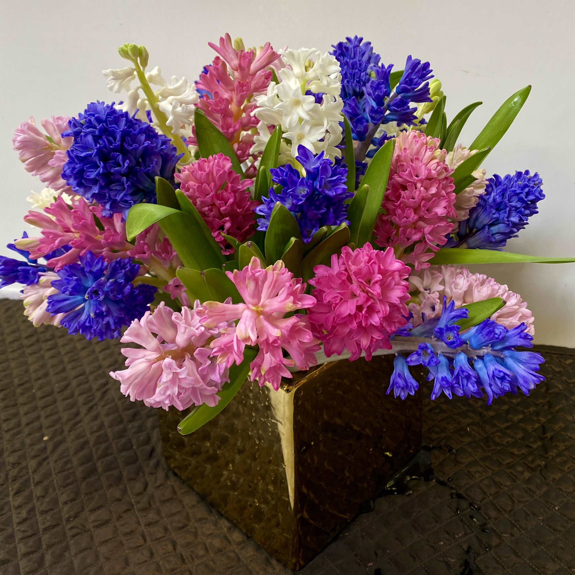 In a pink vase  30 stem hyacinths ( but can be