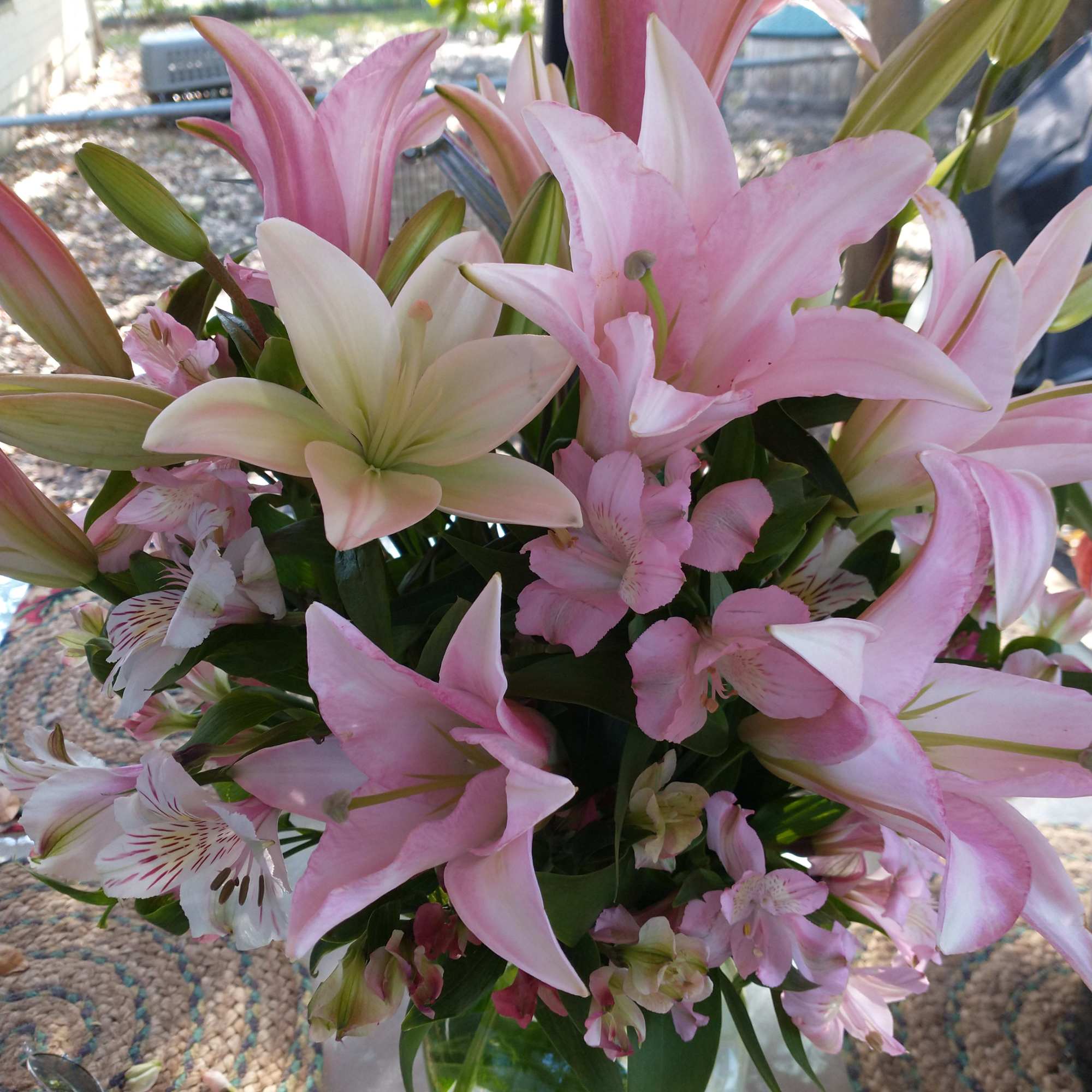 A lovely mix of pale pink and cream colored fresh/artificial 
mix of