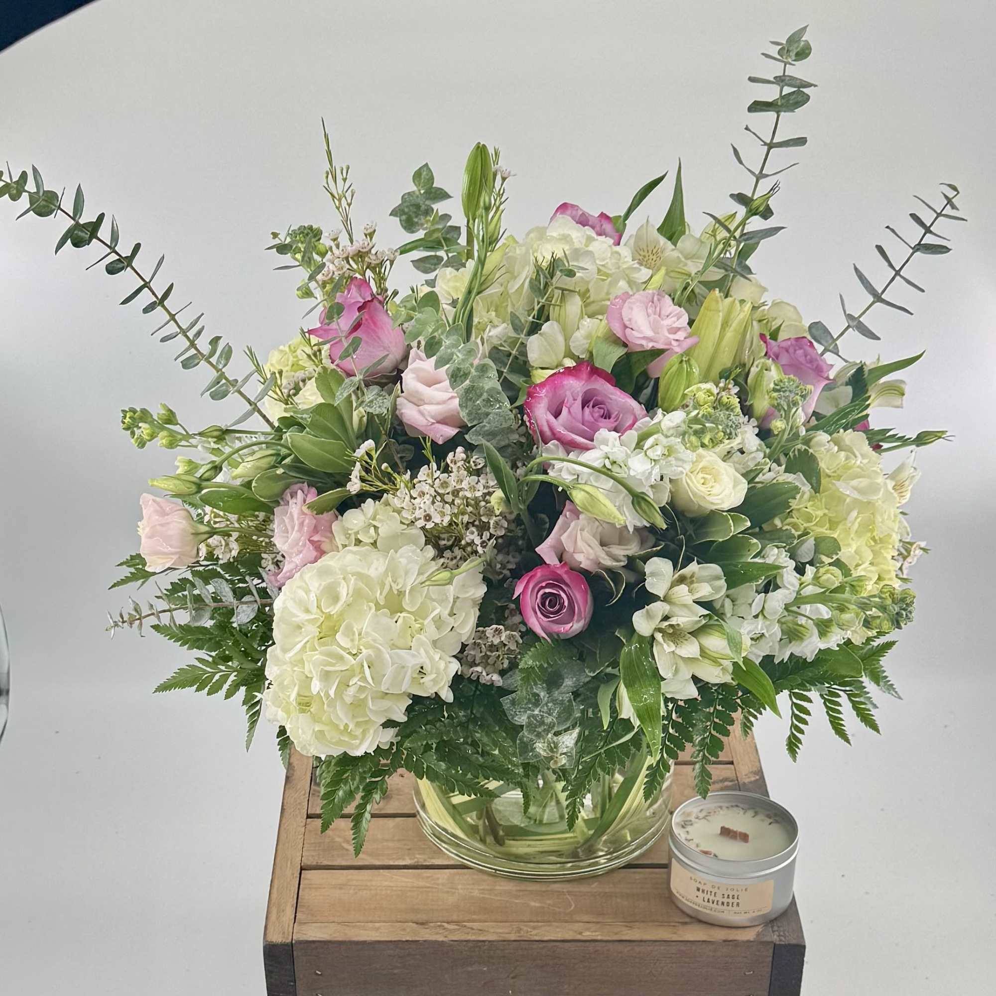 Elevate your special moments with this modern arrangement of roses, hydrangea, white