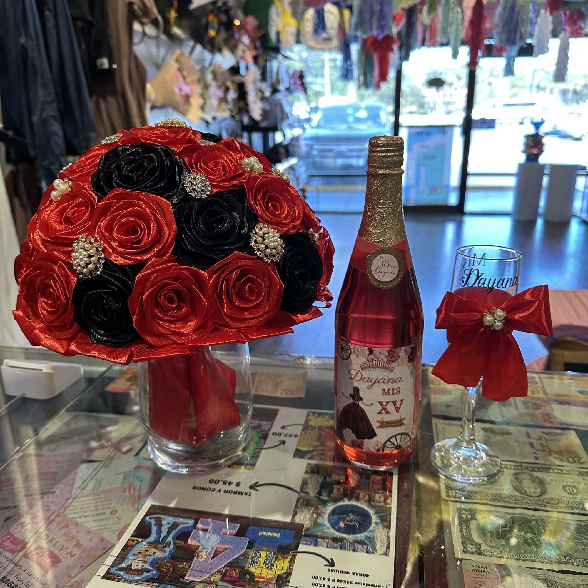 The set of 15 includes 1 bouquet of eternal roses, 1 bottle