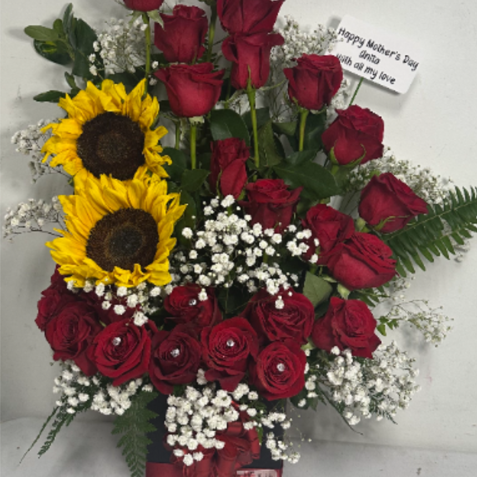 Floral arrangement with 24 roses and 2 sunflowers, perfect for any occasion