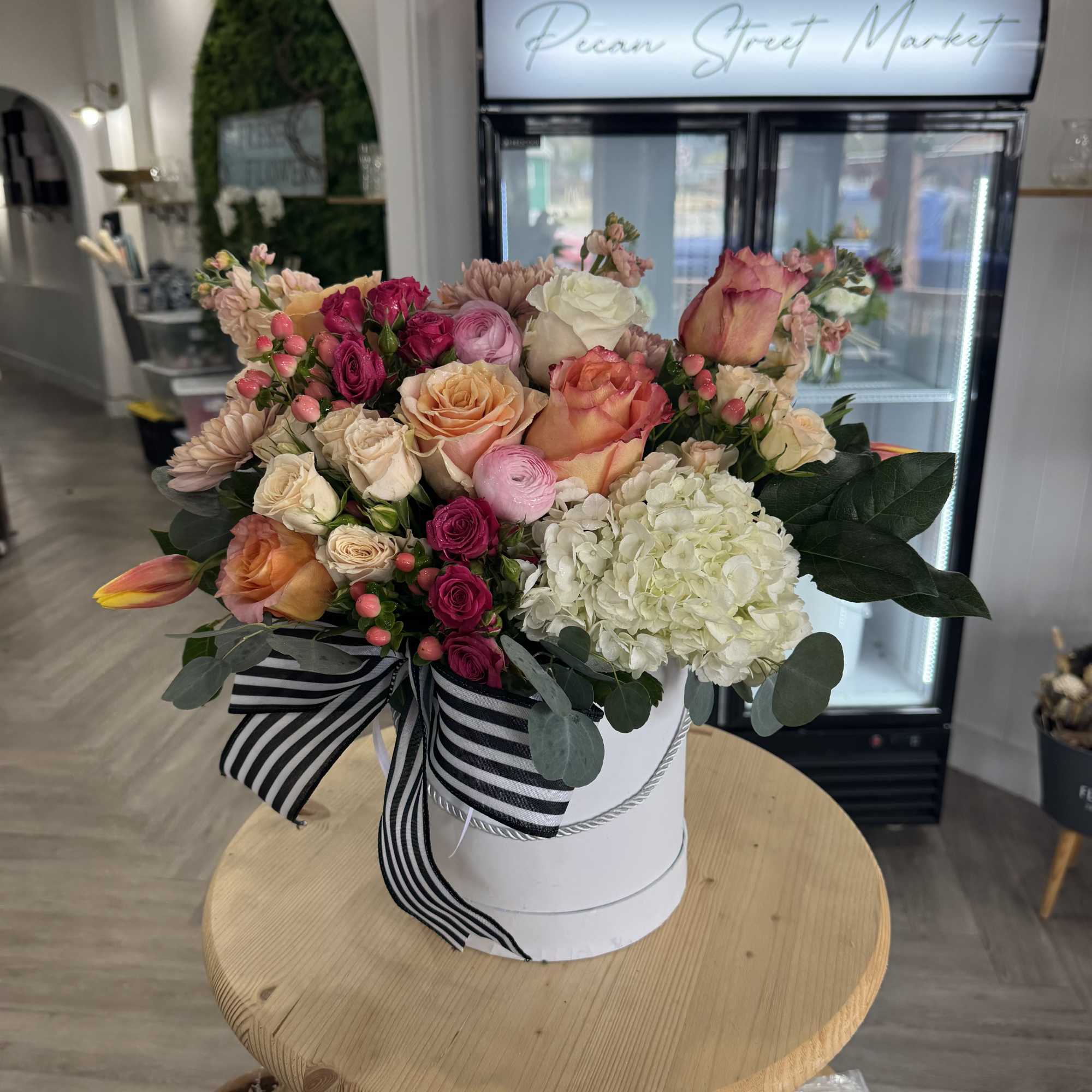 A beautiful mix of hydrangea, peonies, tulips, roses, and snapdragons in a