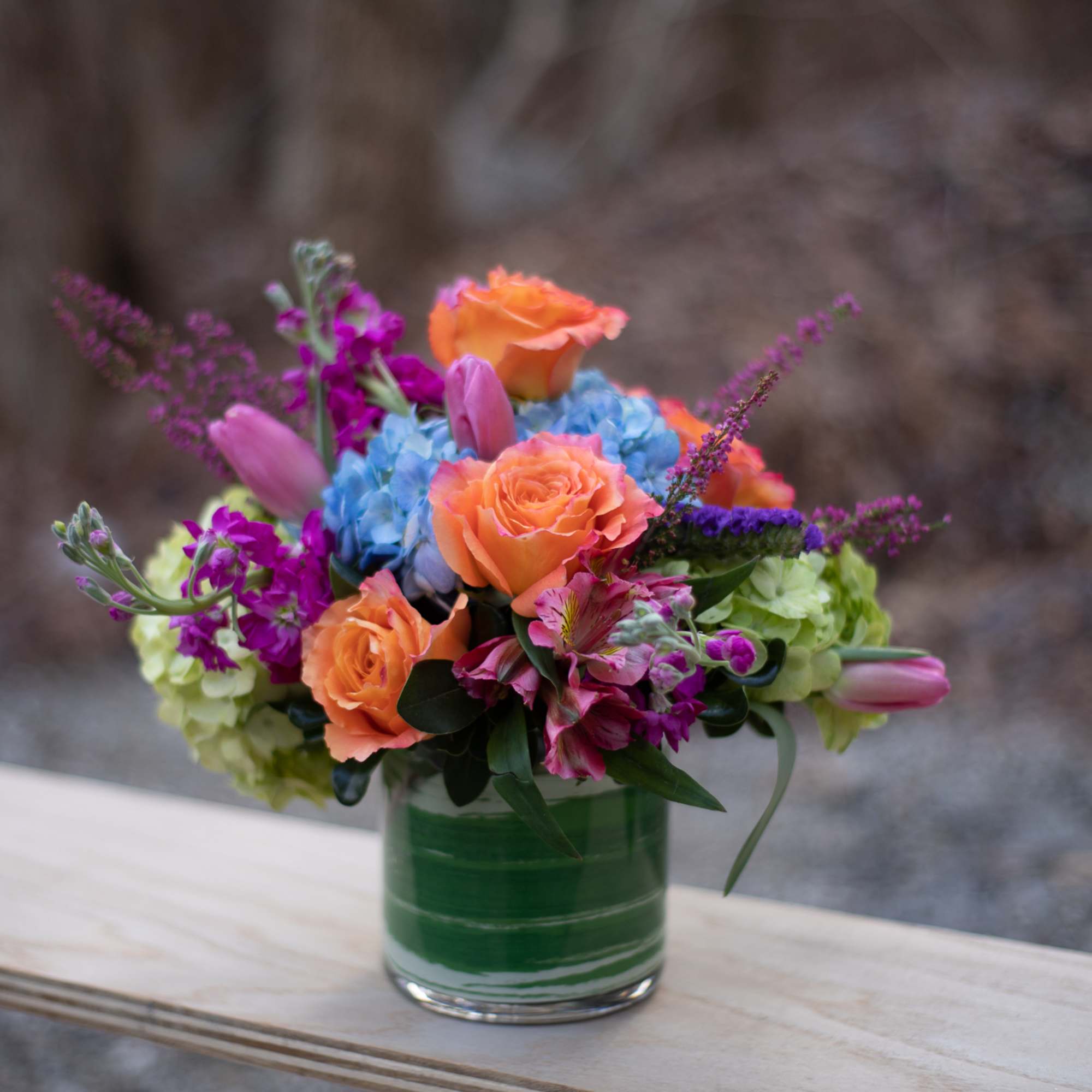 Compact design of complimentary color citrus inspired blooms. Hearty orange-coral toned roses
