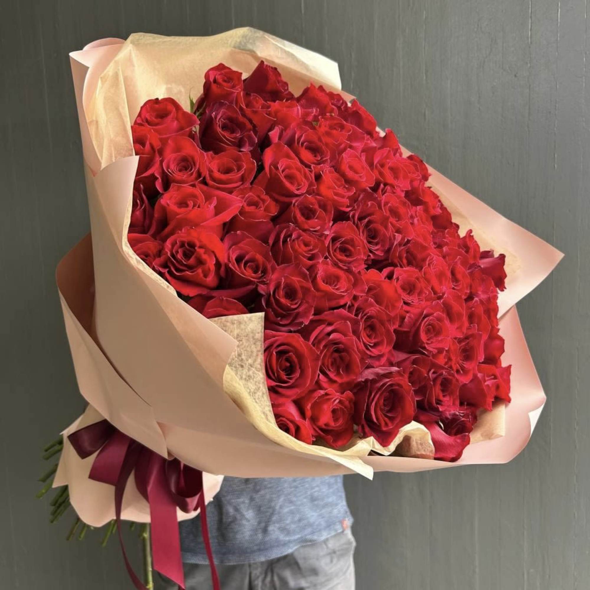 80 delicious and vibrant red roses wrapped as a bouquet. 