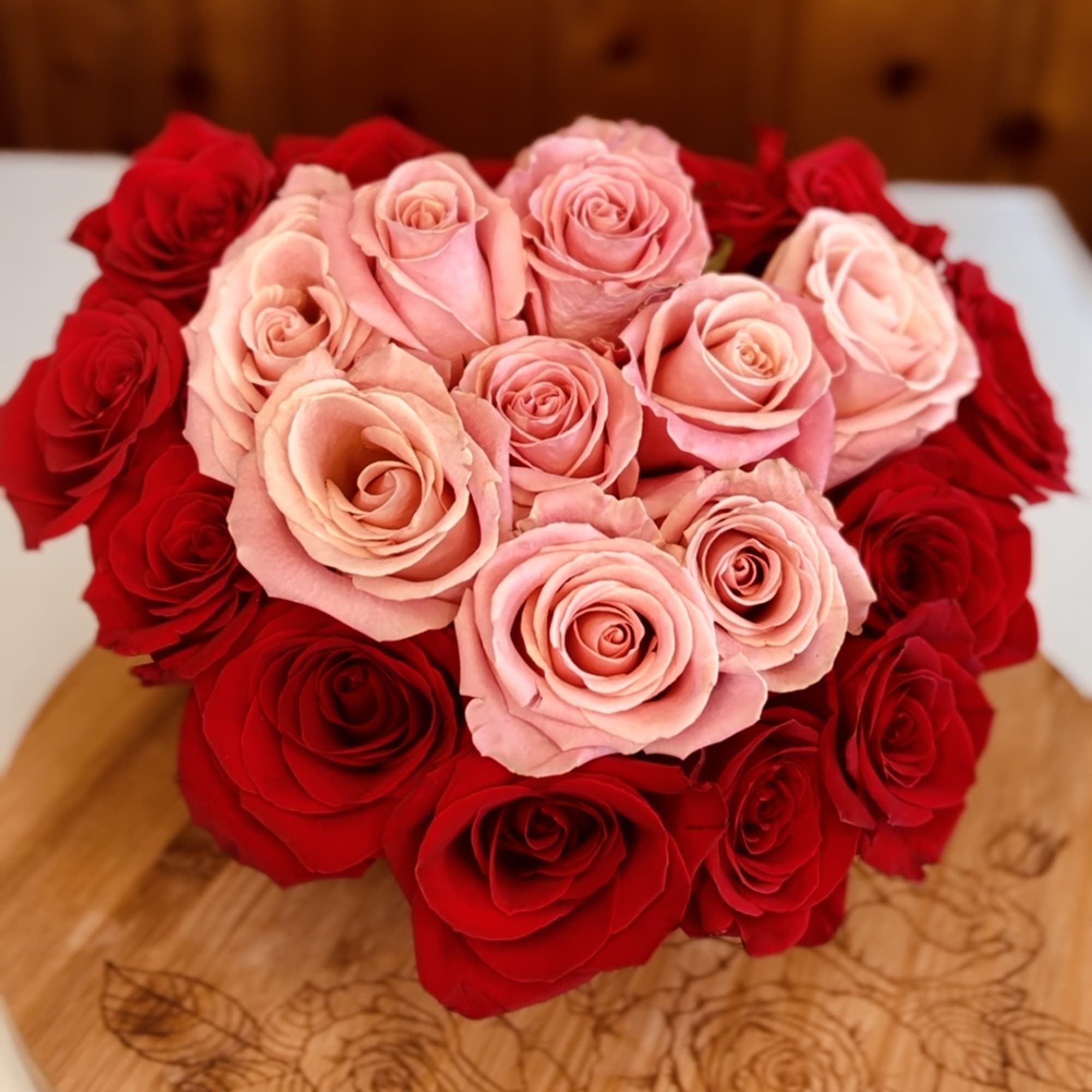 Sent with love in a unique red heart shaped hat box bursting