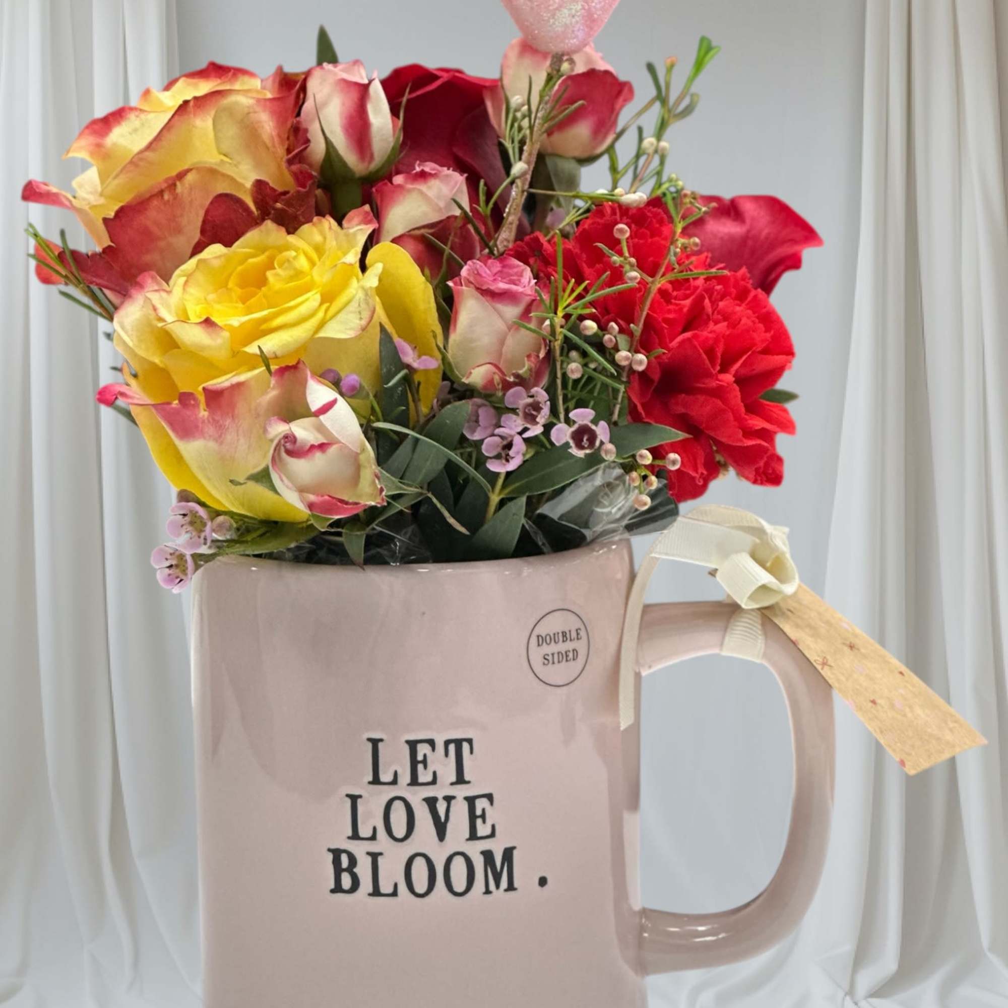 A romantic Valentine&rsquo;s Day floral arrangement designed in a keepsake mug that