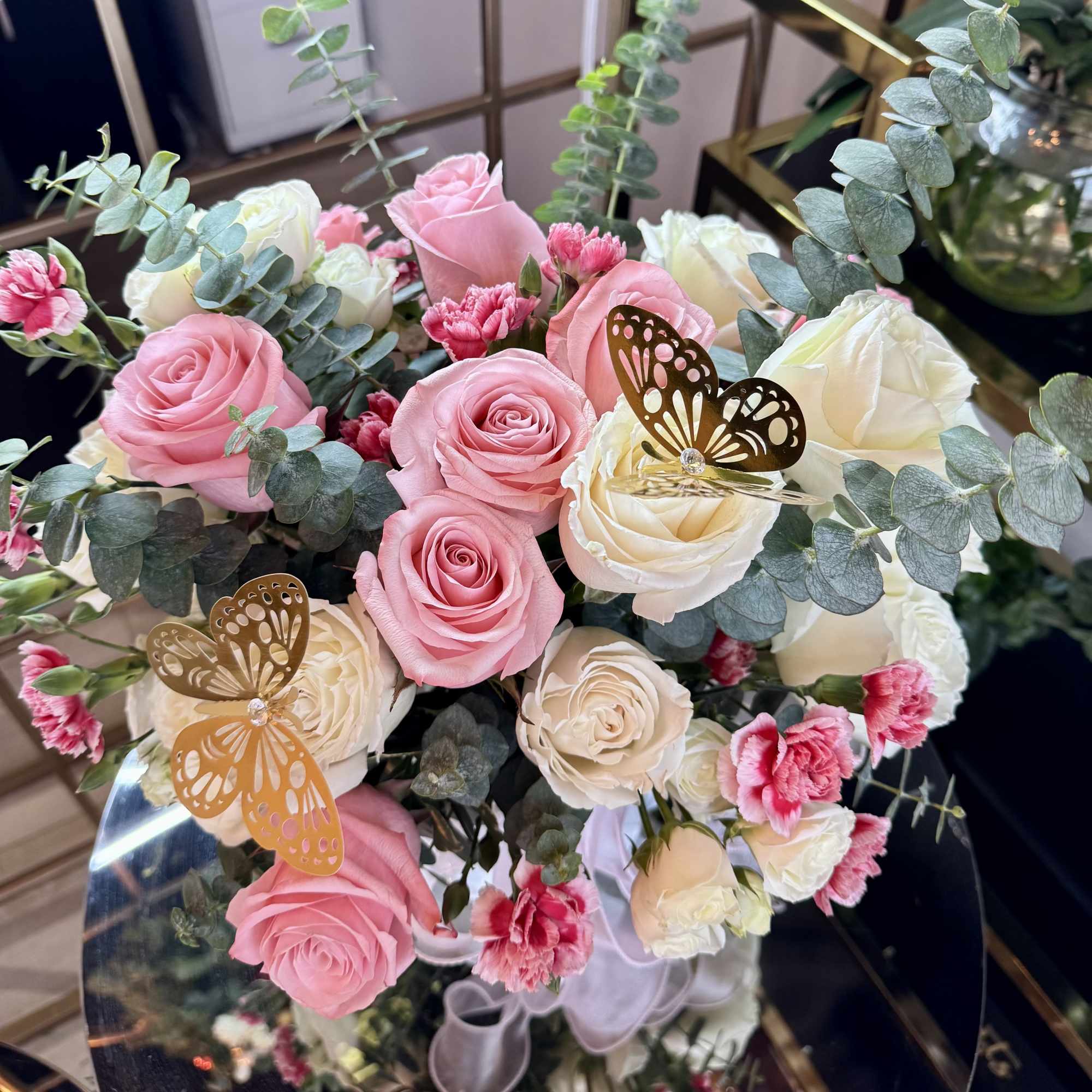 This romantic bouquet features premium pink and white roses paired with ruffled