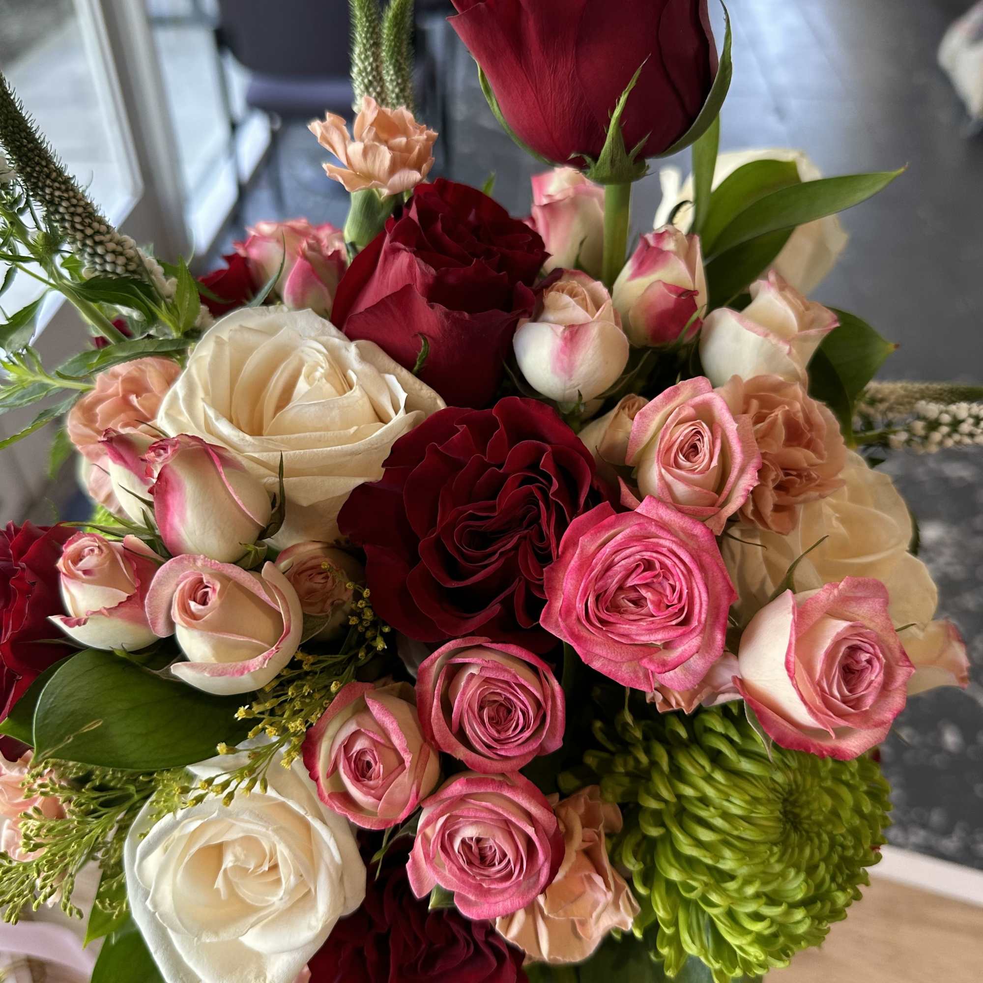 Crimson Grace is a rich and elegant floral arrangement designed in a