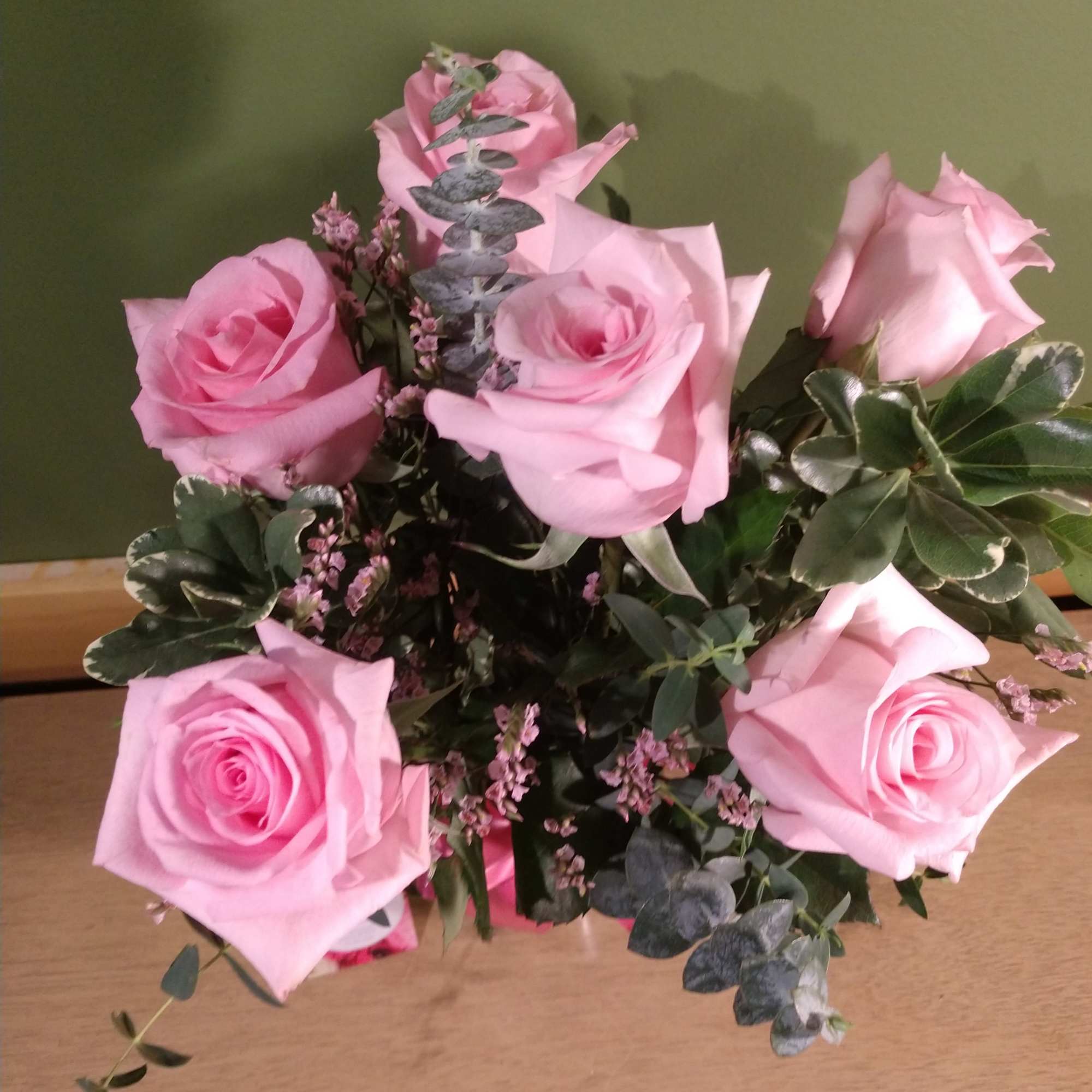 Say it sweeter with this feminine bouquet of pink roses and lush