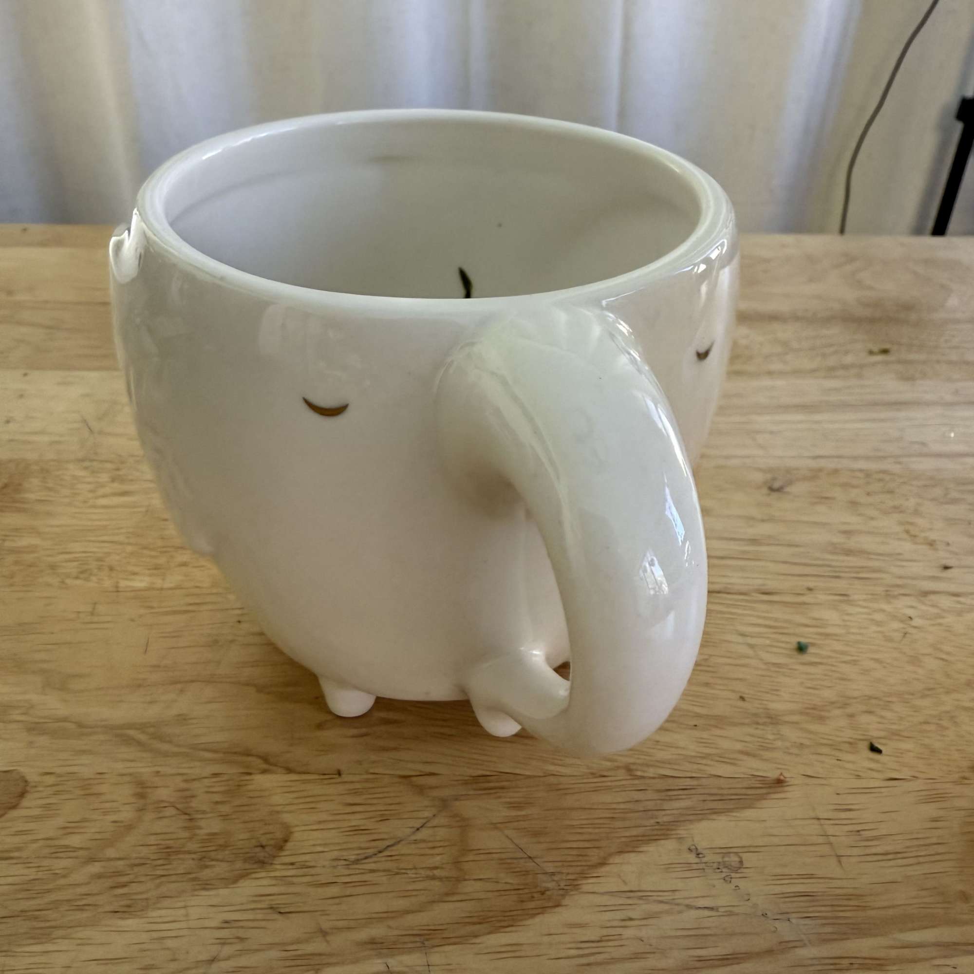 A sweet and charming arrangement featuring soft pink roses, daisies, and fresh