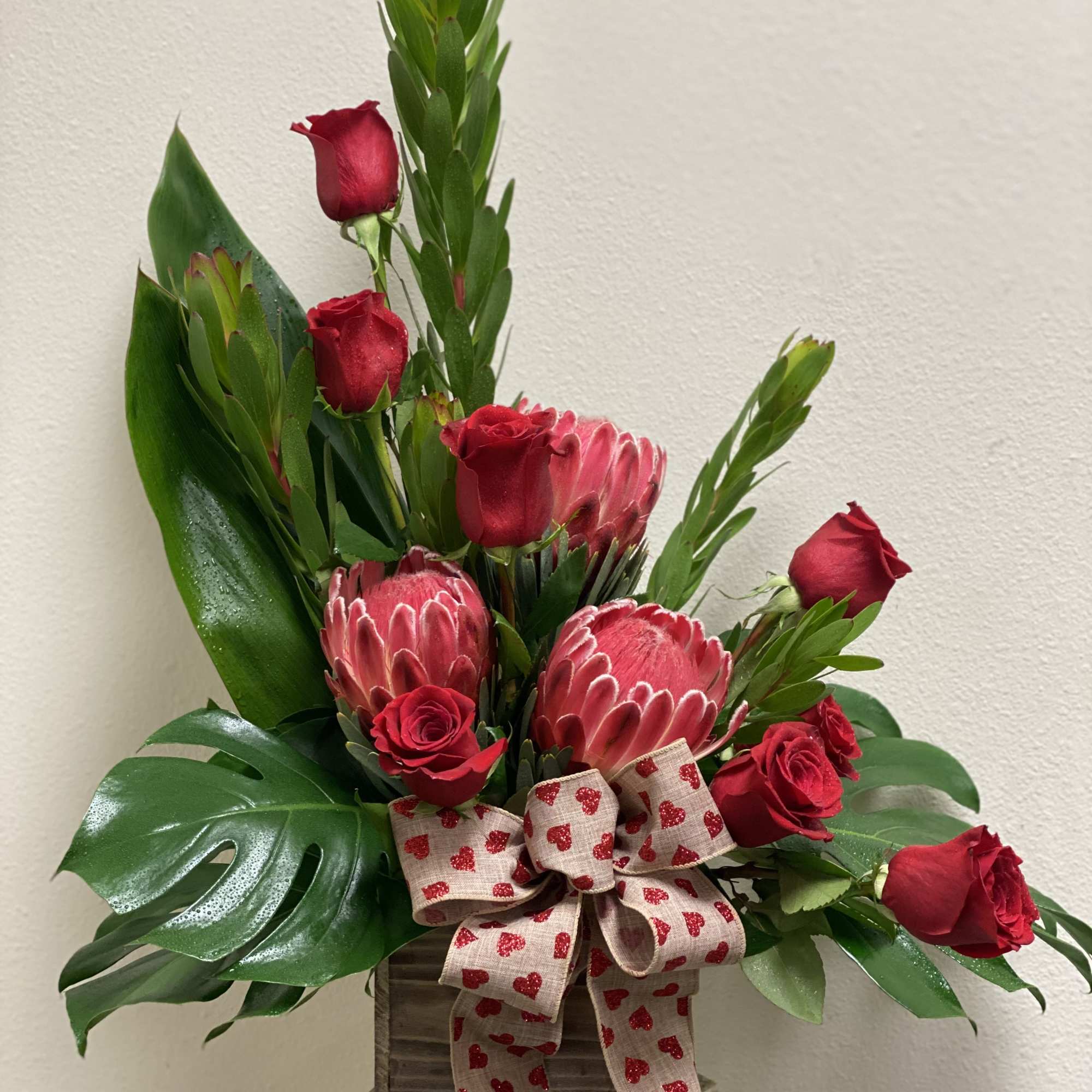 Passion Protea this gorgeous Tropical arrangement uniquely designed with Protea roses tea