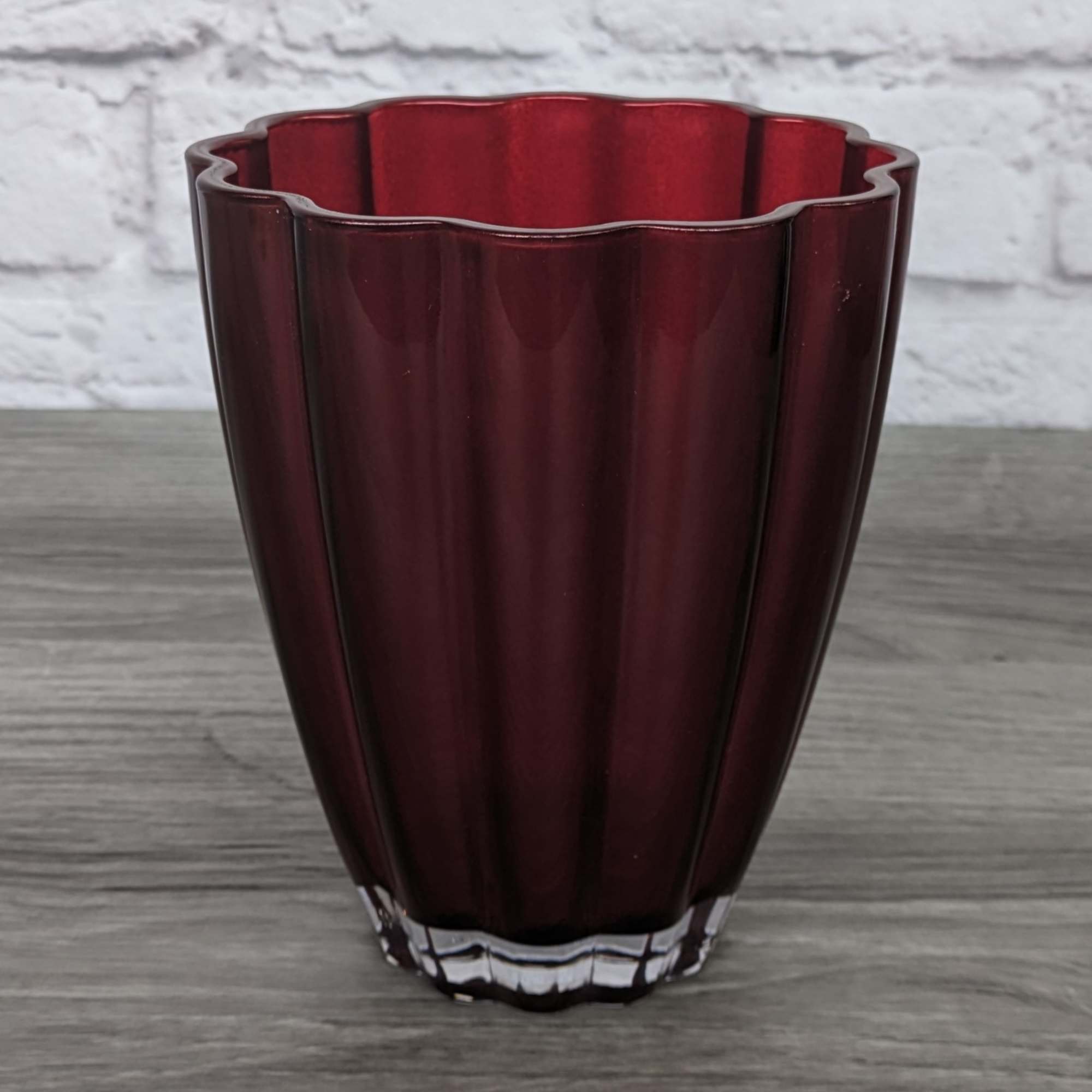 Refined Red Roses uses shorter rose stems in a colored glass vase