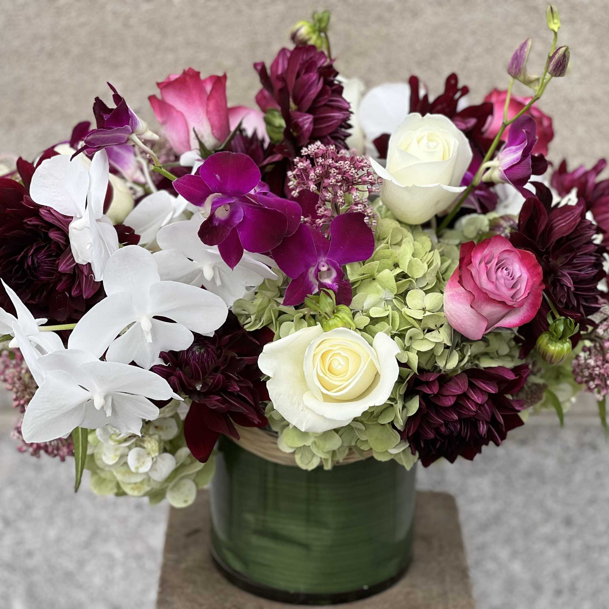 LUSH ASSORTMENT OF ROSES, PINK ASCLEPIAS, NUIT D'ETE DAHLIAS, WHITE PHALAENOPSIS ORCHIDS