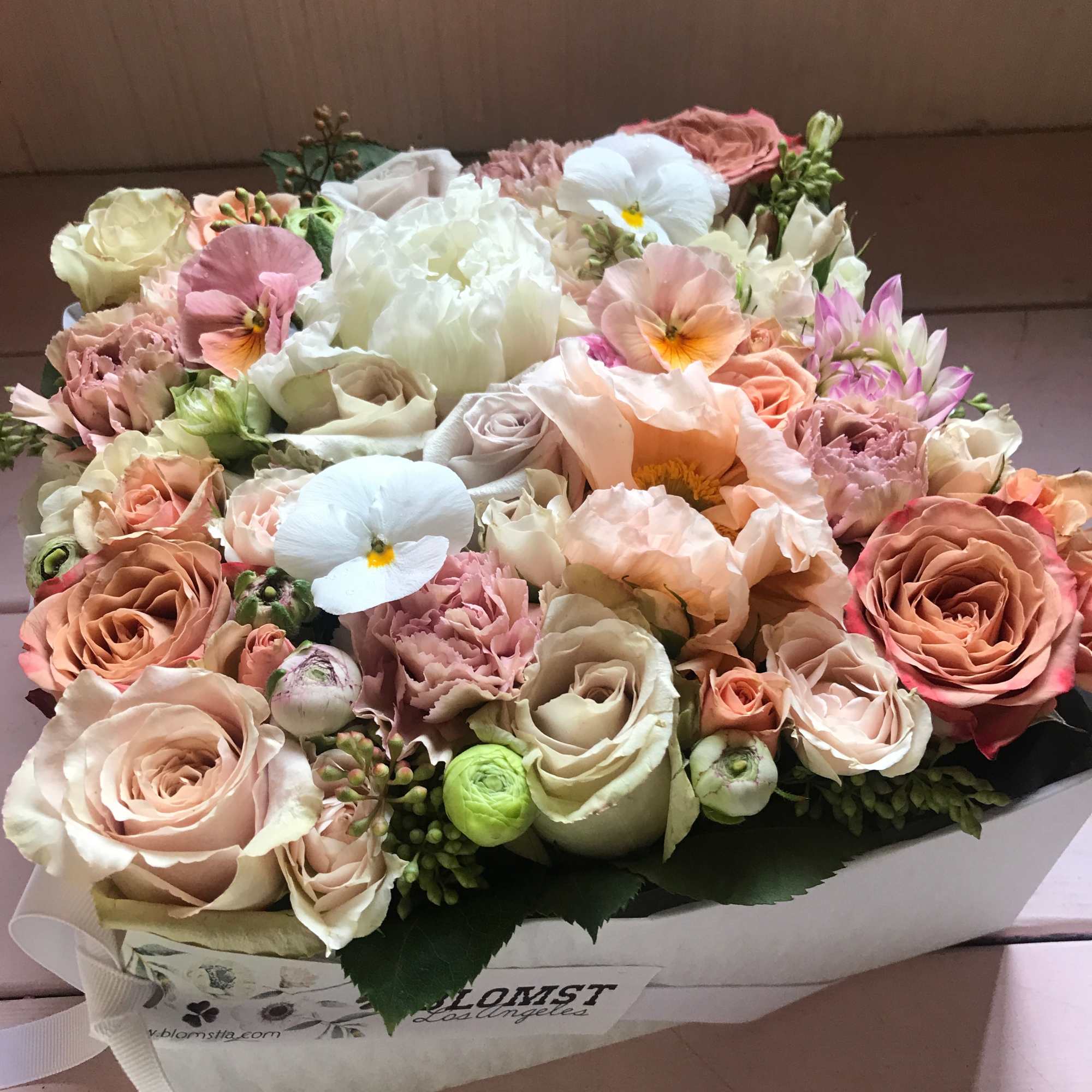Beautiful blooming signature Blomst flower box full of fresh flowers in a
