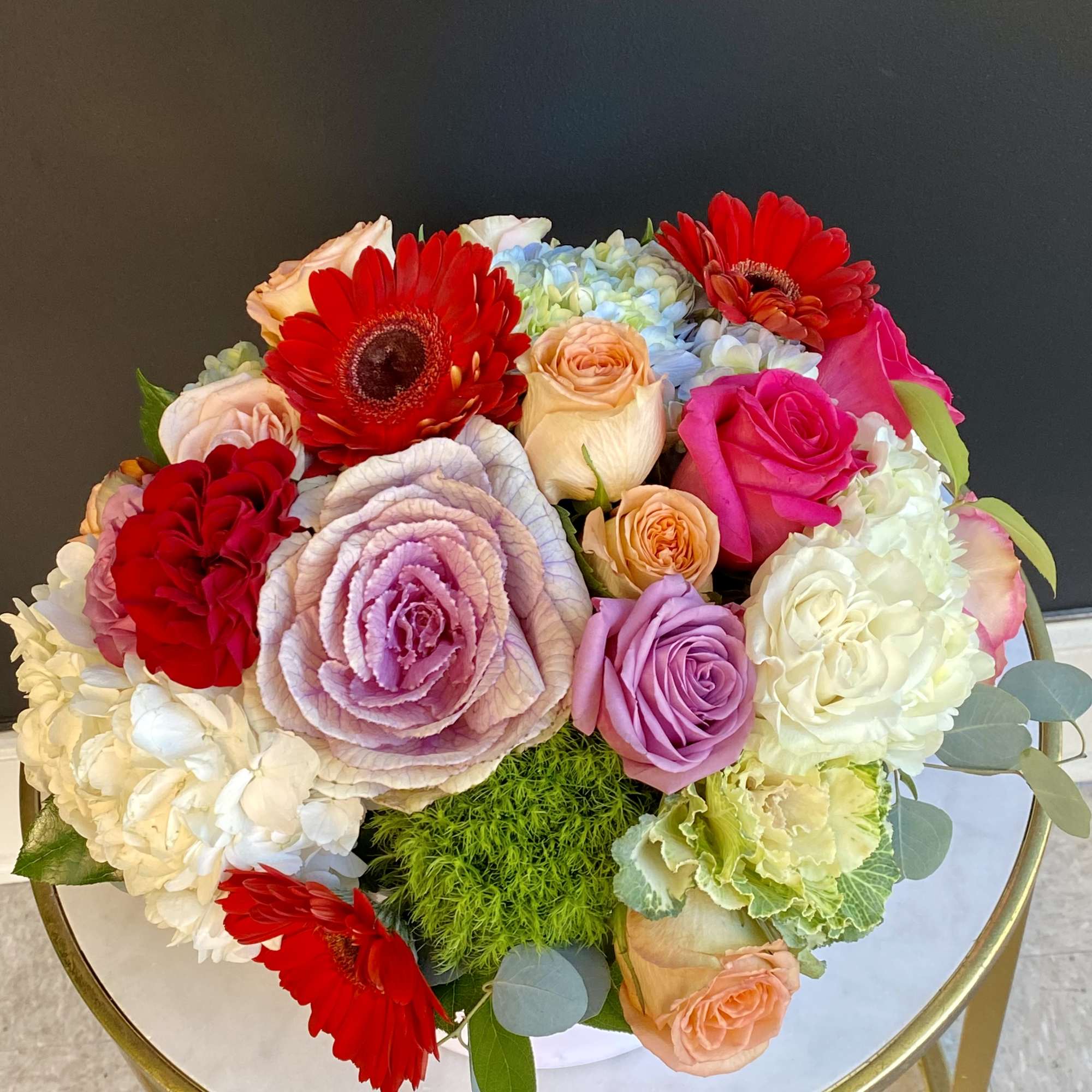 This signature flower box of love featuring an assortment of Roses, Hydrangeas