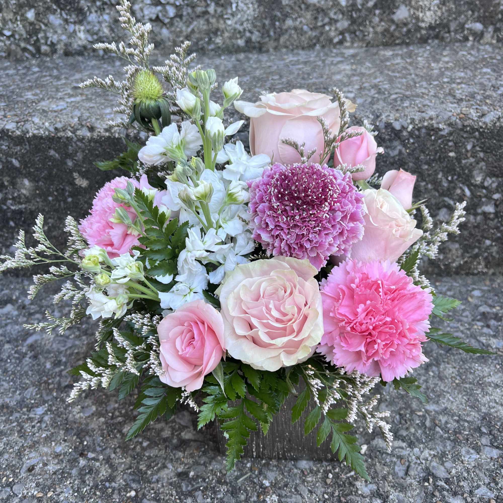 This beautiful arrangement has stock, roses, spray, roses, Misty, Scabiosa. Carnations and