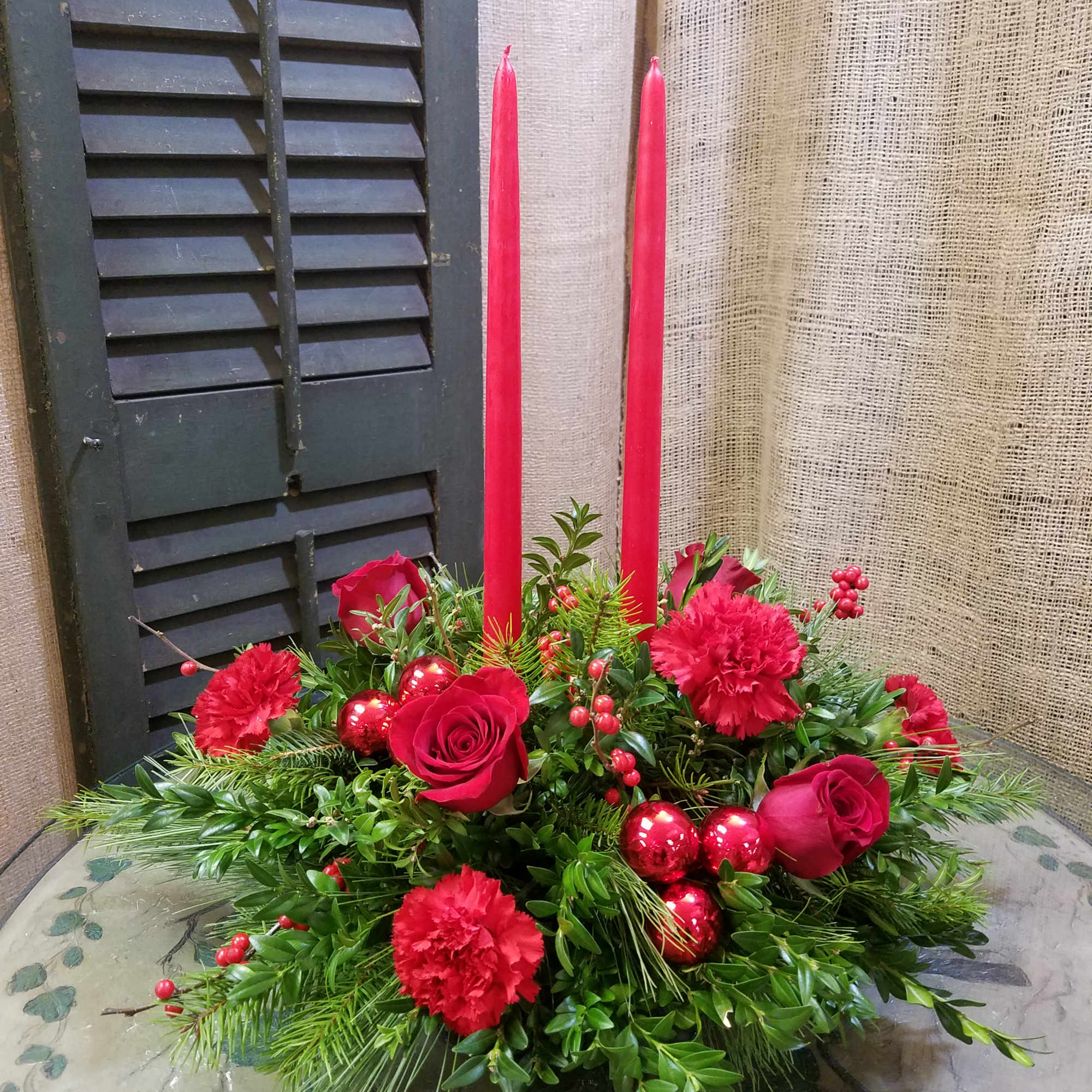 Cheerful Christmas Candle Centerpiece

Bring warmth and festive charm to your holiday d&eacute;cor
