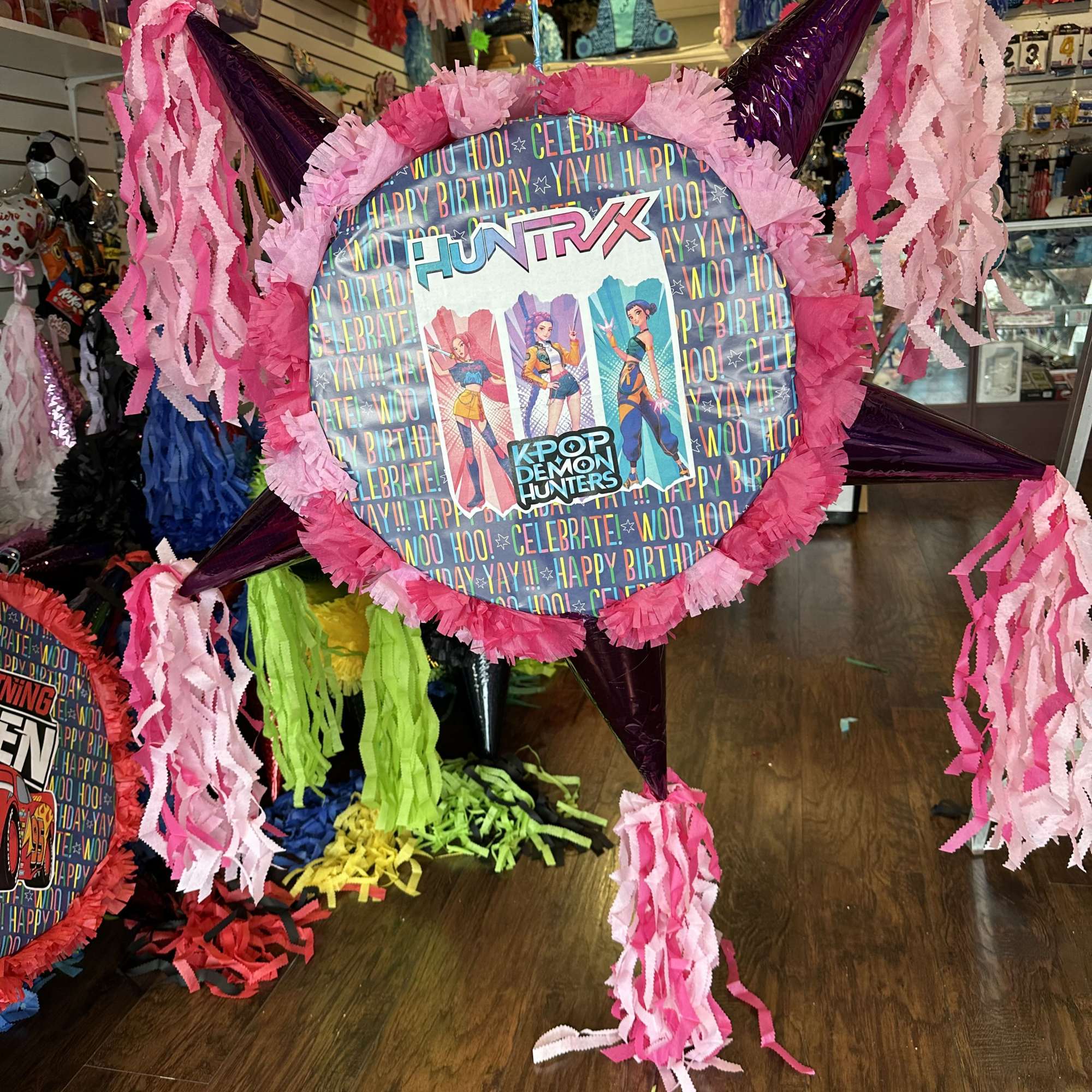 Colorful ball pi&ntilde;atas with plenty of room for different themed sweets