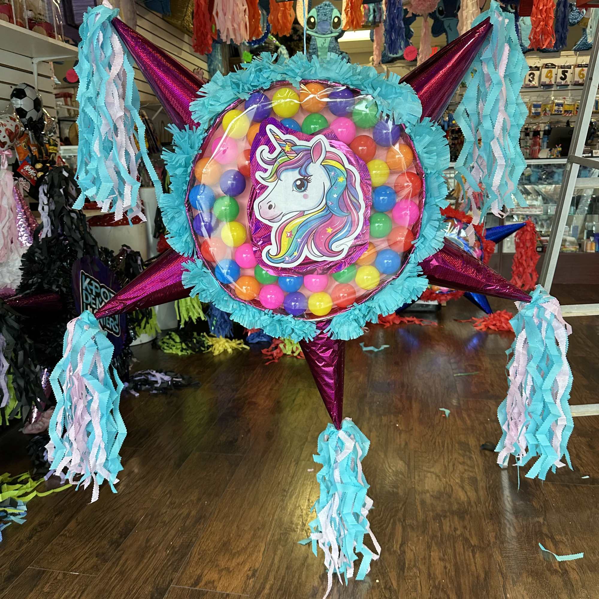 Colorful ball pi&ntilde;atas with plenty of room for different themed sweets