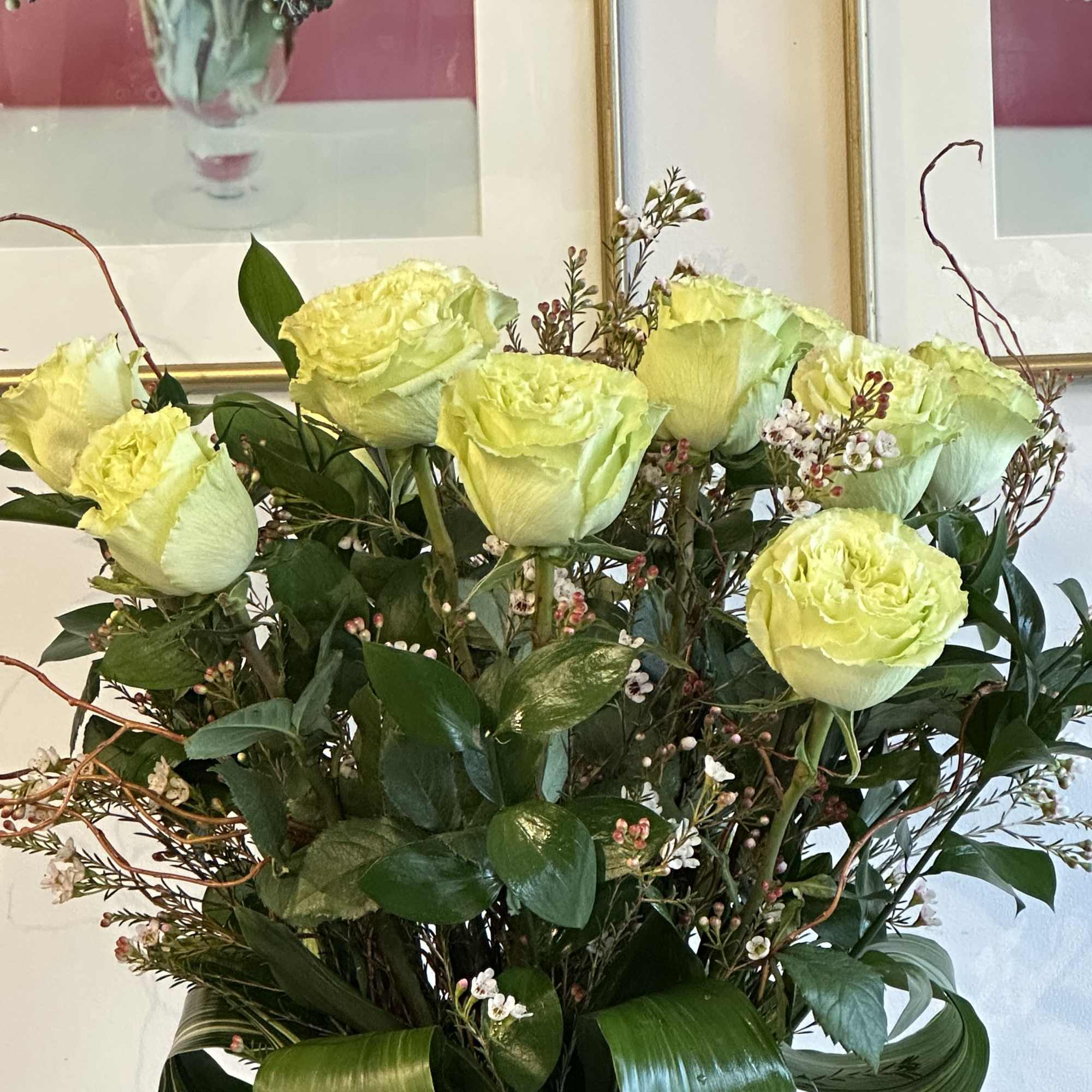 these classic arrangements, accented with seasonal foliage, are available in three stunning